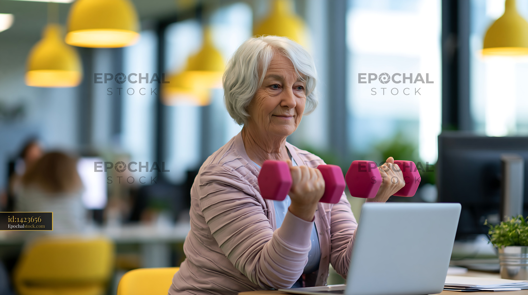 Watermarked full-resolution preview of Senior woman exercises with dumbbells at a bright office