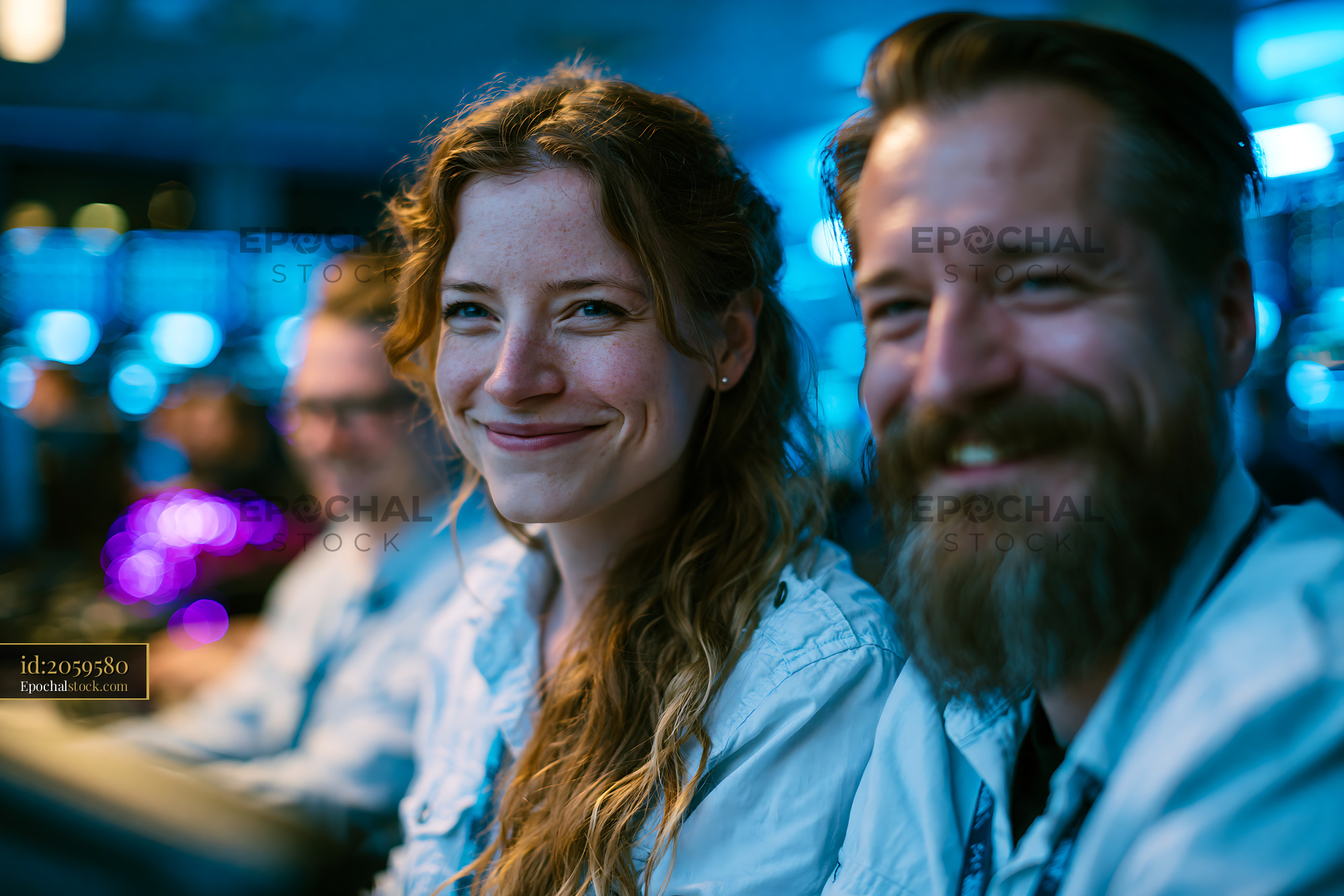 Watermarked full-resolution preview of Smiling people enjoying a gathering in a dimly lit room
