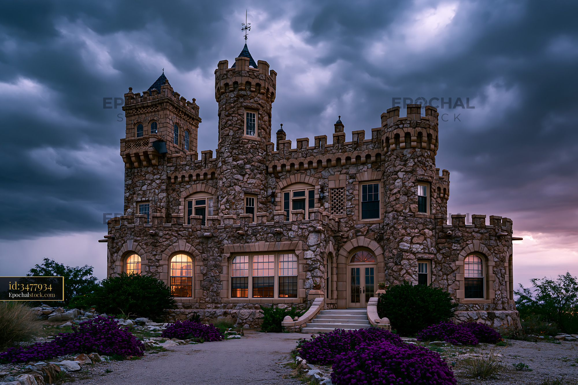 Watermarked full-resolution preview of Stone fortress illuminated beneath a dramatic evening sky