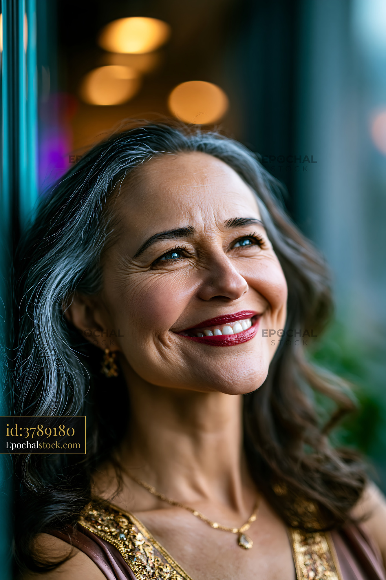 Watermarked full-resolution preview of Smiling woman with gray hair enjoying her time indoors