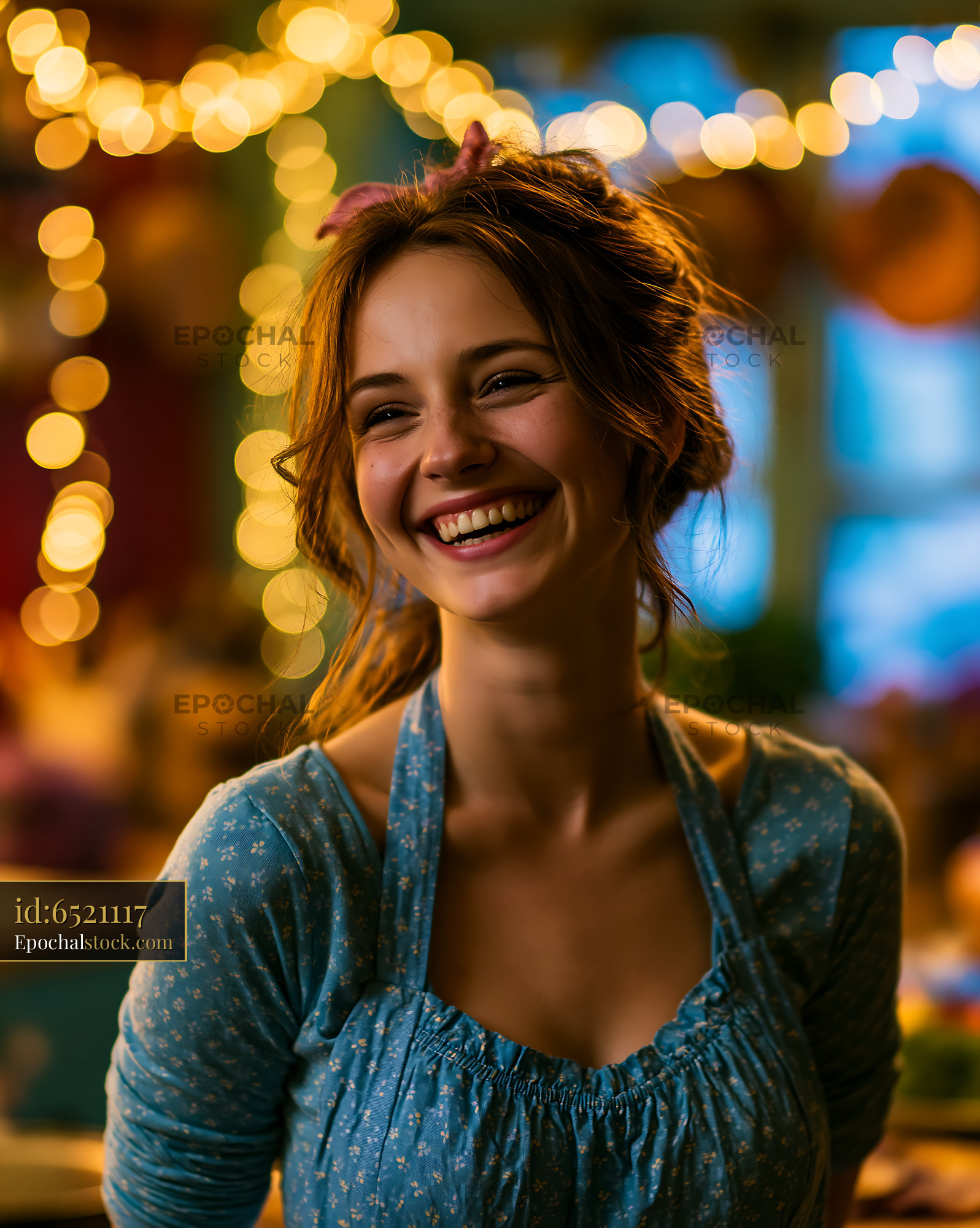 Watermarked full-resolution preview of Smiling woman in a cozy kitchen with warm lights