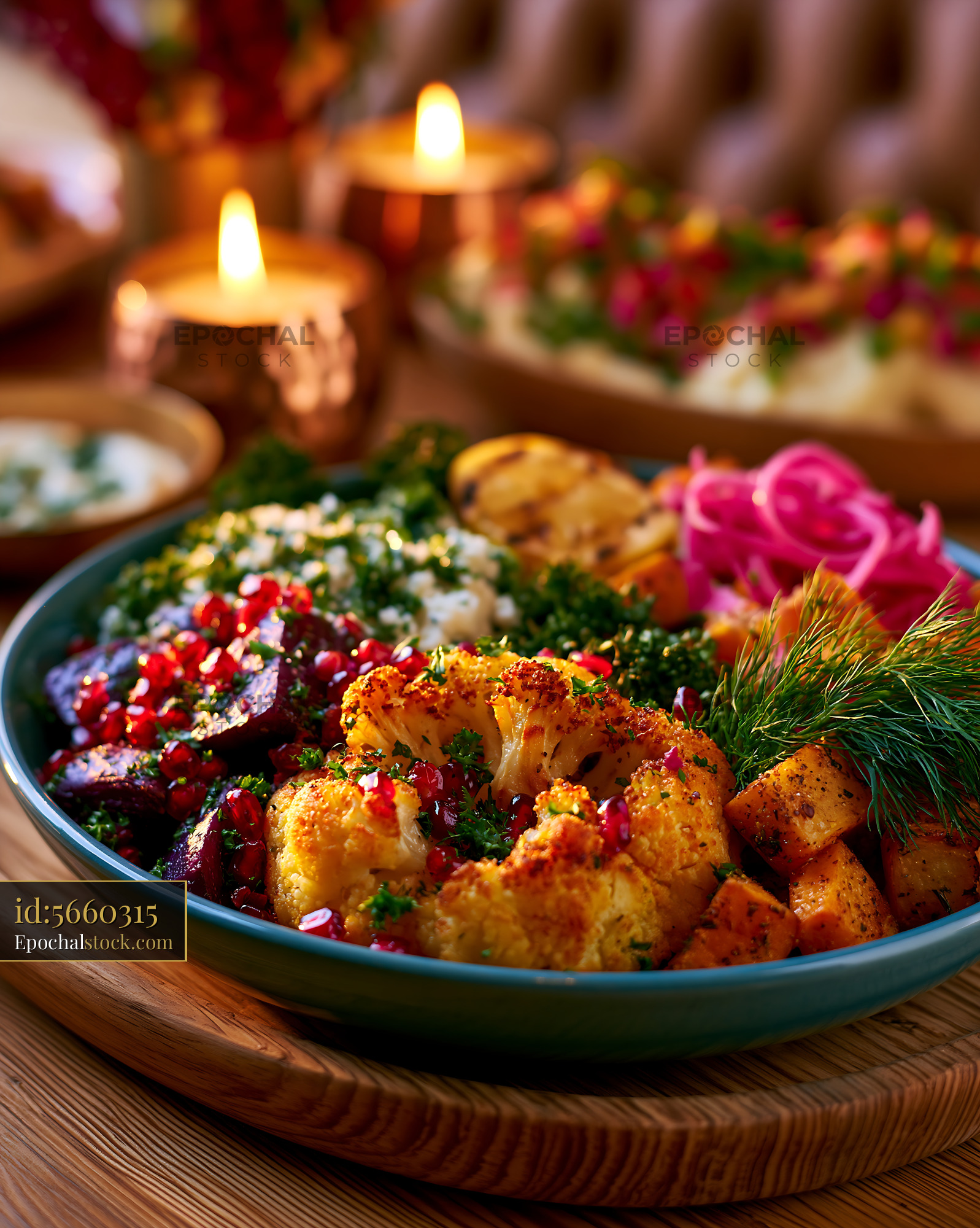 Watermarked full-resolution preview of Colorful roasted vegetable platter in warm candlelight