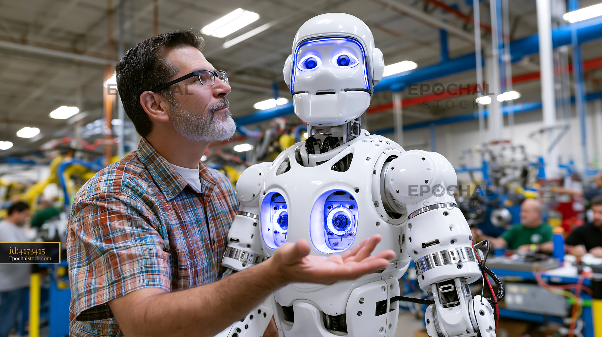 Watermarked full-resolution preview of Engineer interacts with humanoid robot in busy factory setting