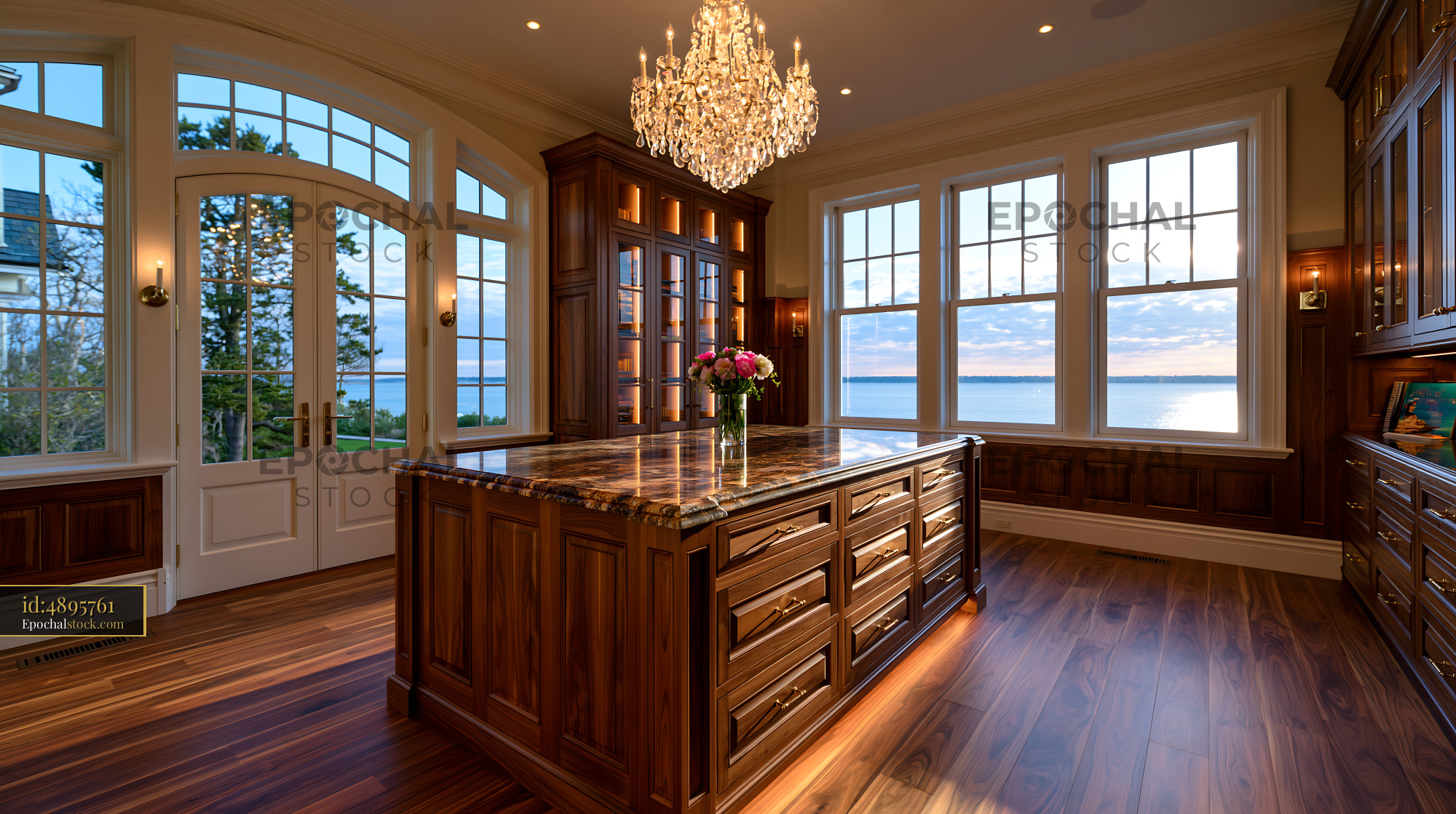 Kitchen Interior With Island and Lake View in Golden Hour - stock photo