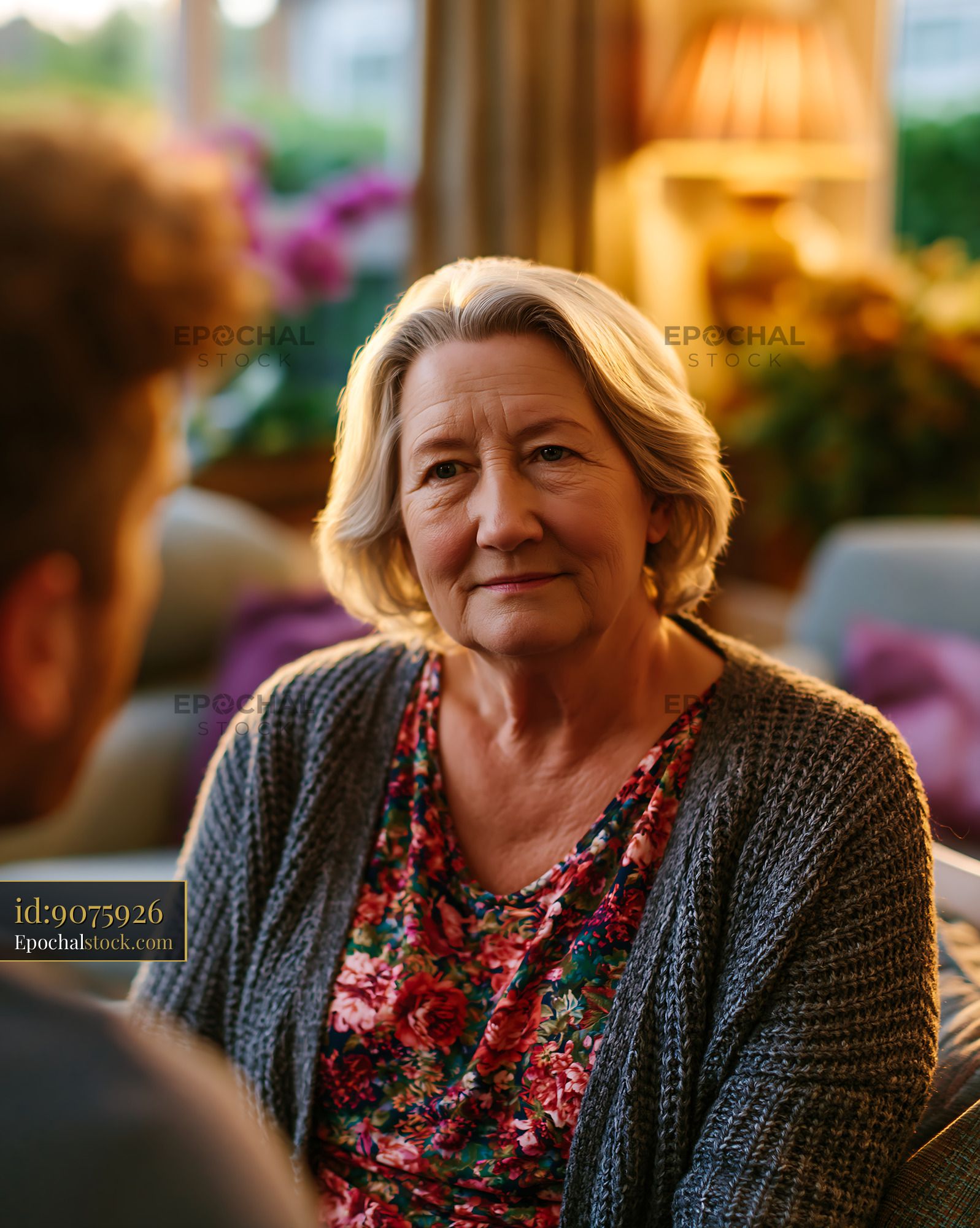Watermarked full-resolution preview of Woman sitting and listening in a cozy indoor setting