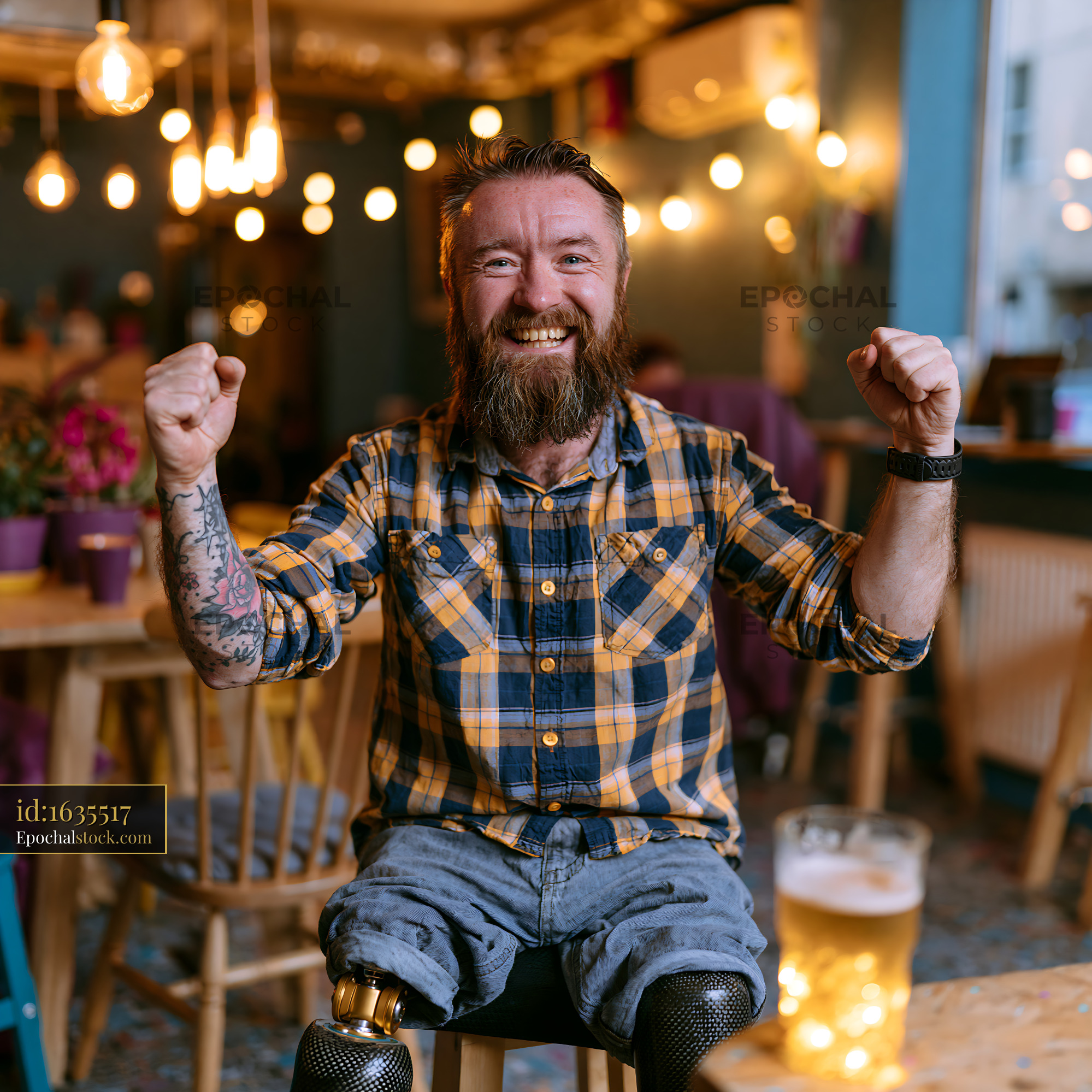 Watermarked full-resolution preview of Man celebrates joyfully in a cozy pub with a drink during the evening