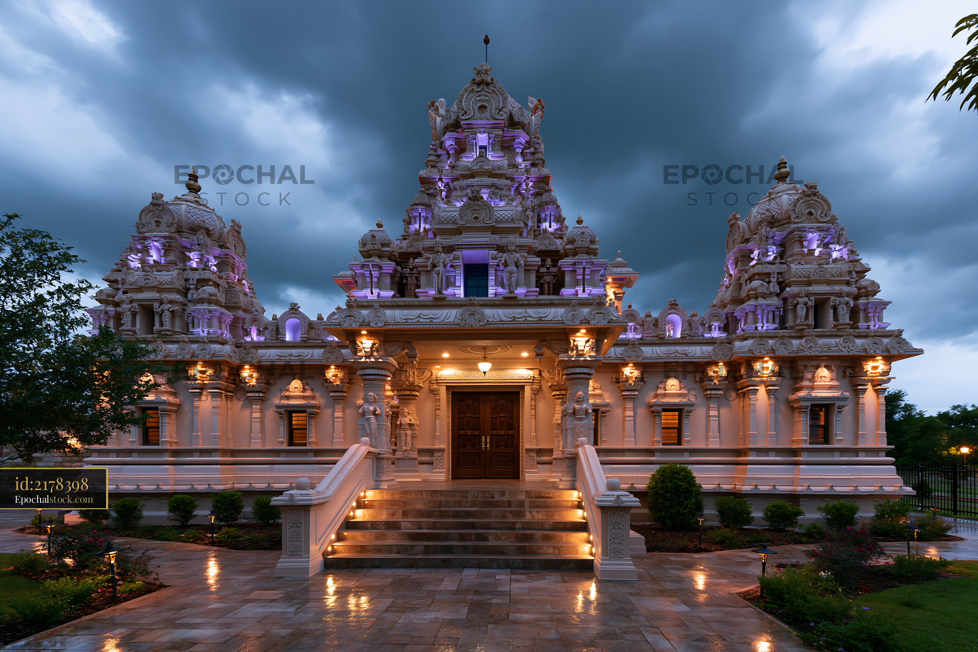 Watermarked full-resolution preview of Hindu temple with ornate architecture and cloudy sky at dusk