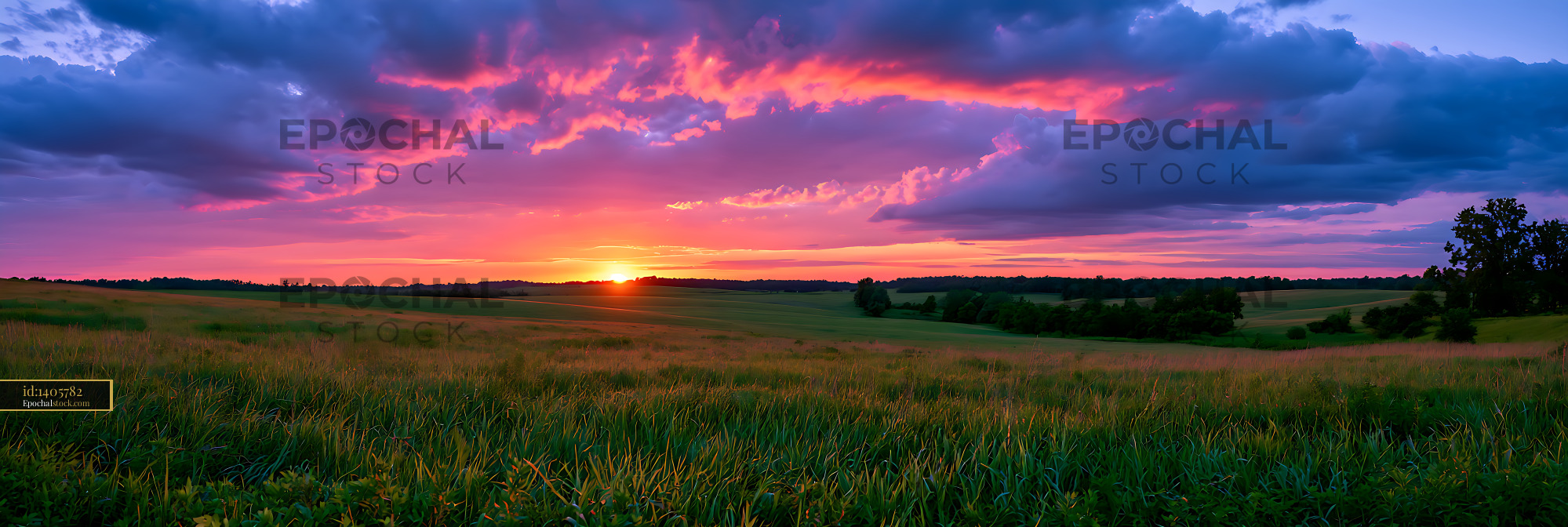 Watermarked full-resolution preview of Colorful sunset above green countryside fields