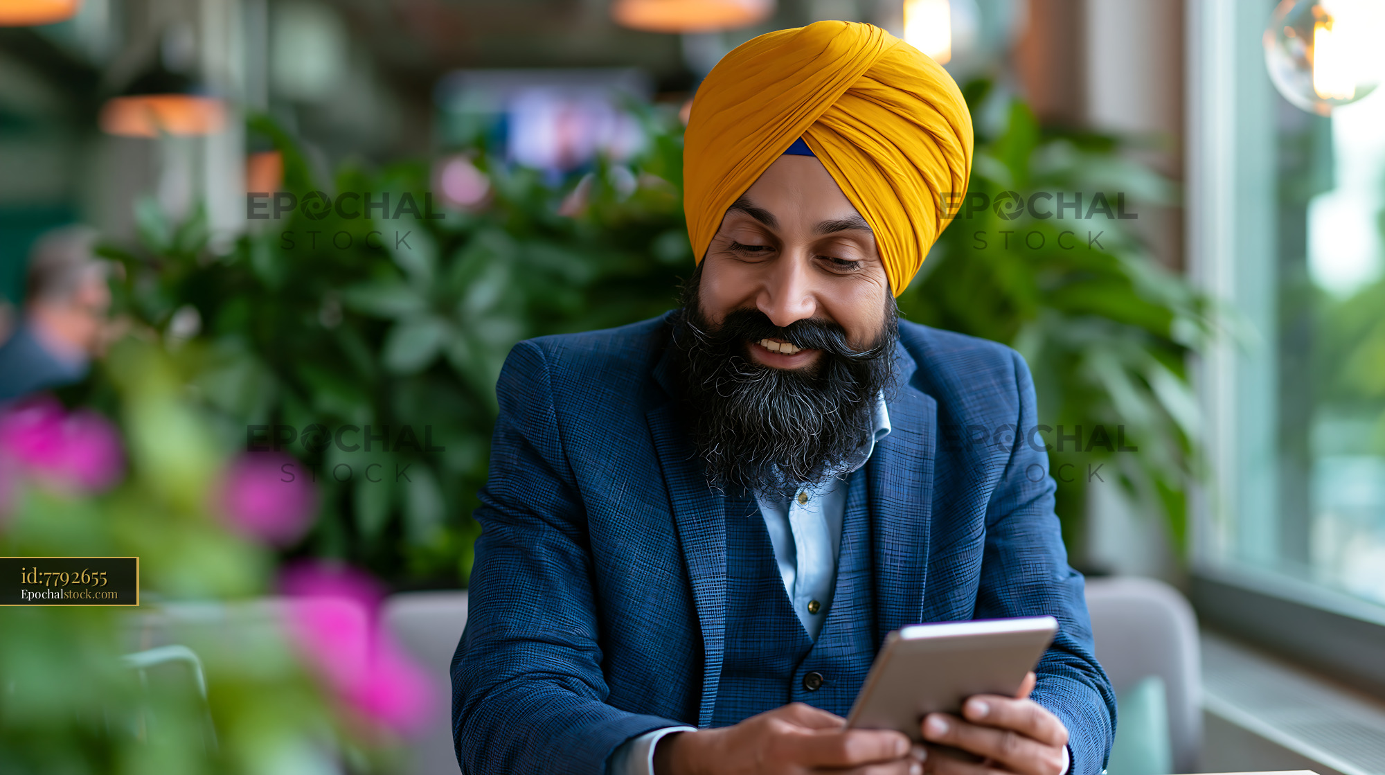 Watermarked full-resolution preview of Businessman in suit using smartphone in modern cafe