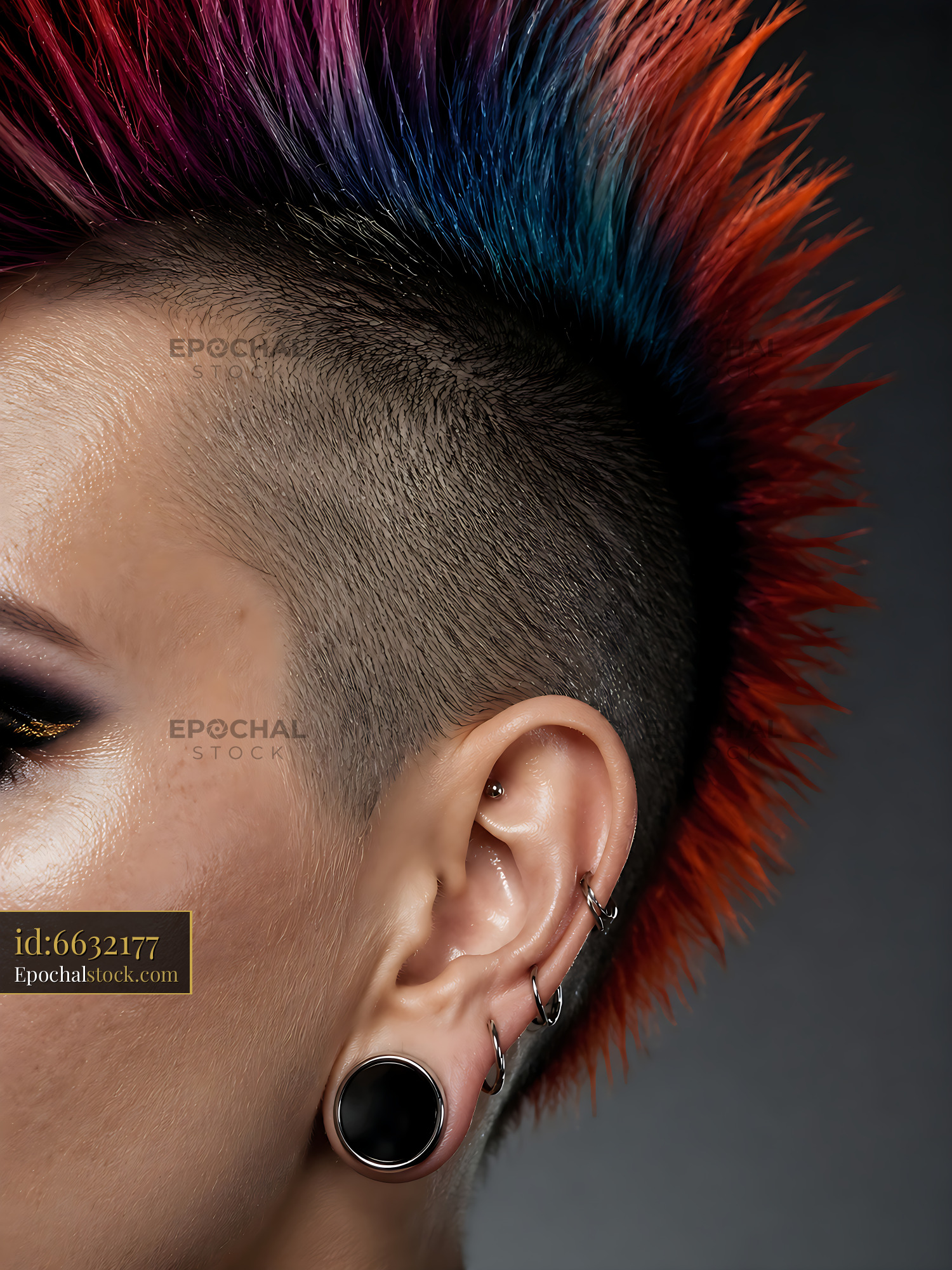 Hair Style Features Colorful Spikes With Piercings on Display - stock photo