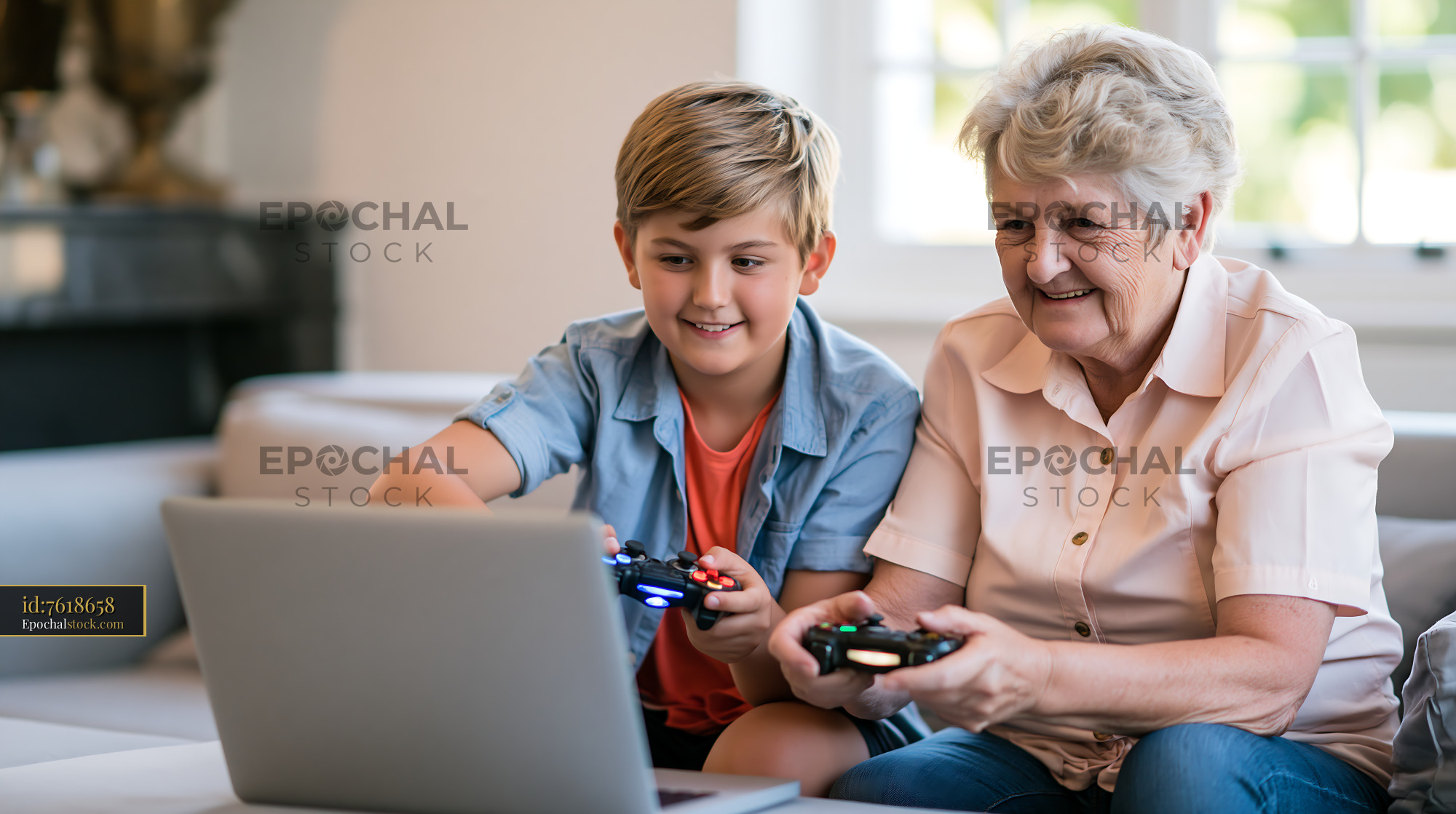 Watermarked full-resolution preview of Grandmother and grandson playing video games together in living room