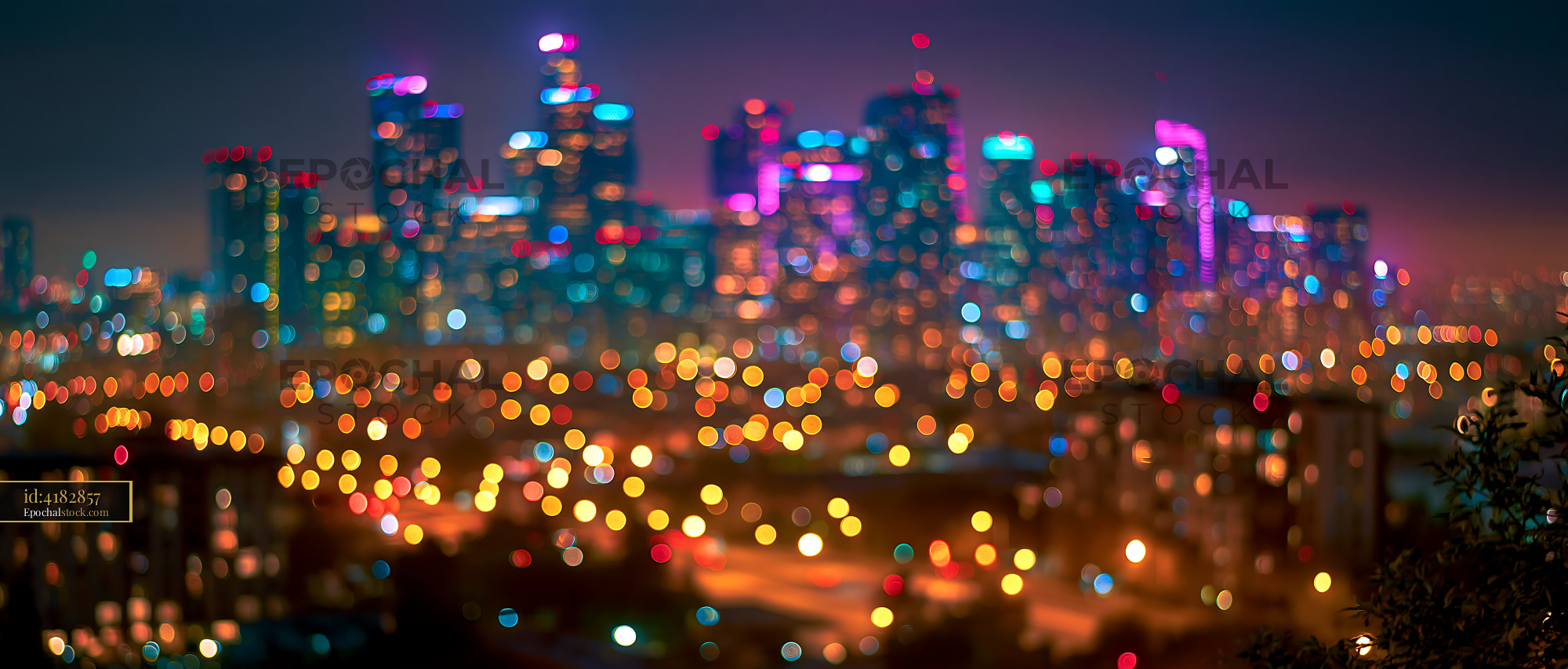 Watermarked full-resolution preview of City skyline at night with colorful lights
