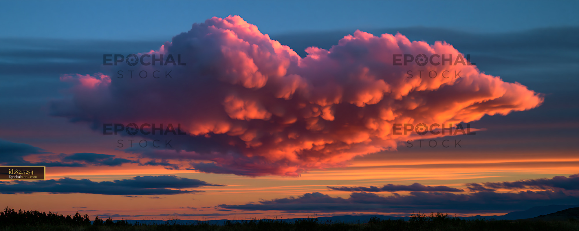 Watermarked full-resolution preview of Sunset clouds fill the sky with pink and orange hues