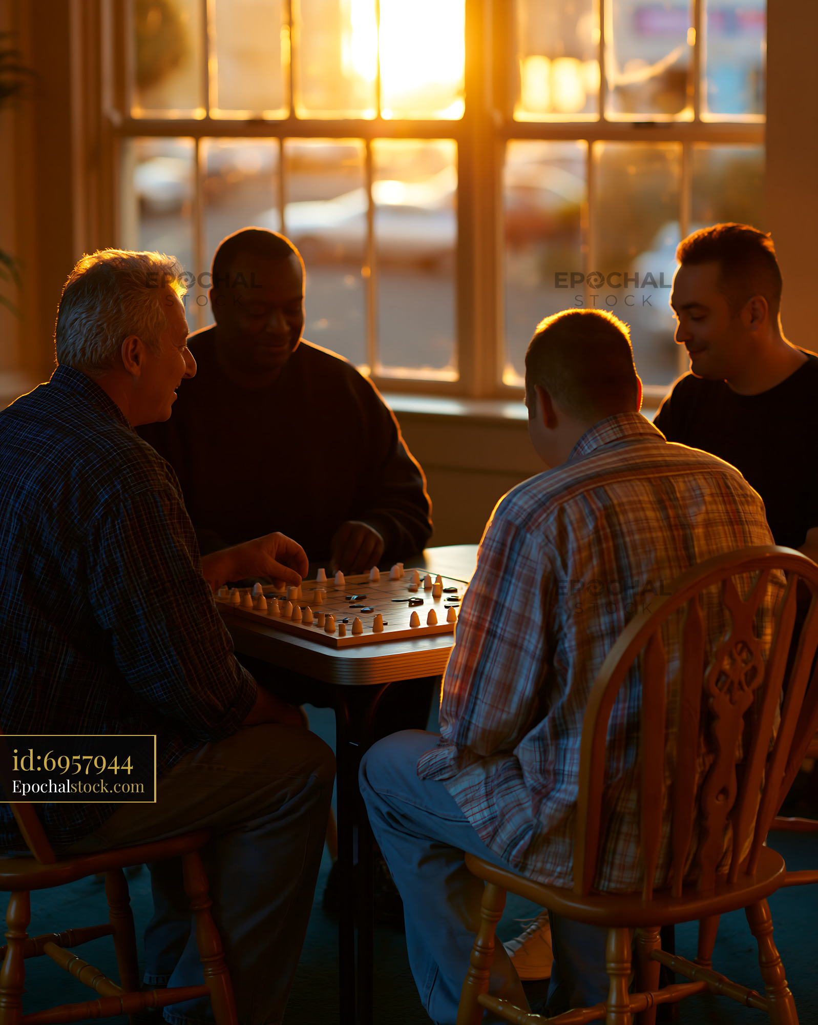 Watermarked full-resolution preview of Friends playing chess during sunset