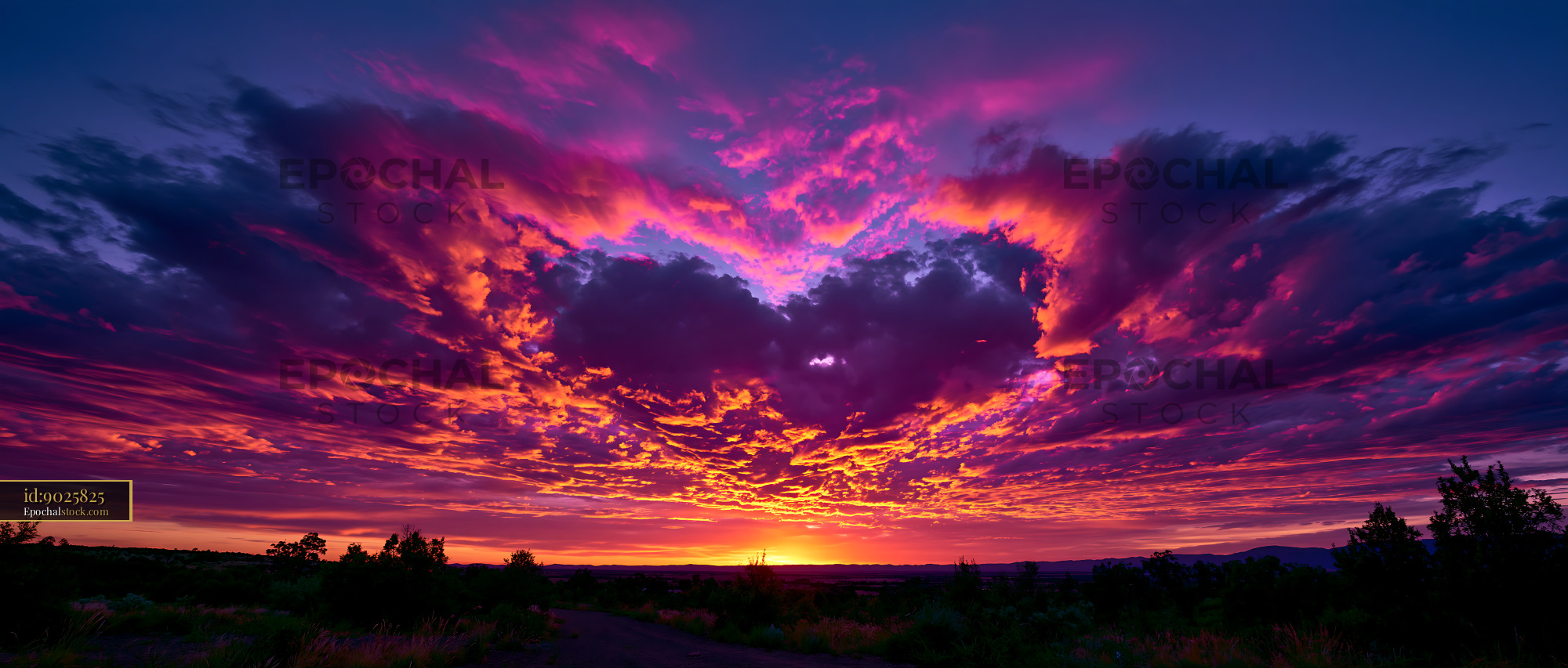 Watermarked full-resolution preview of Colorful sunset with clouds in the sky over the horizon