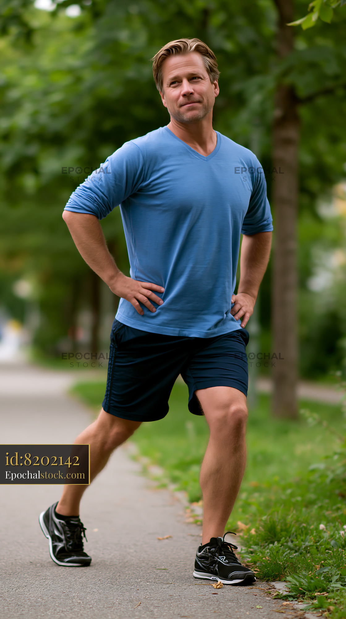 Watermarked full-resolution preview of Man jogging on a path in a park during daytime