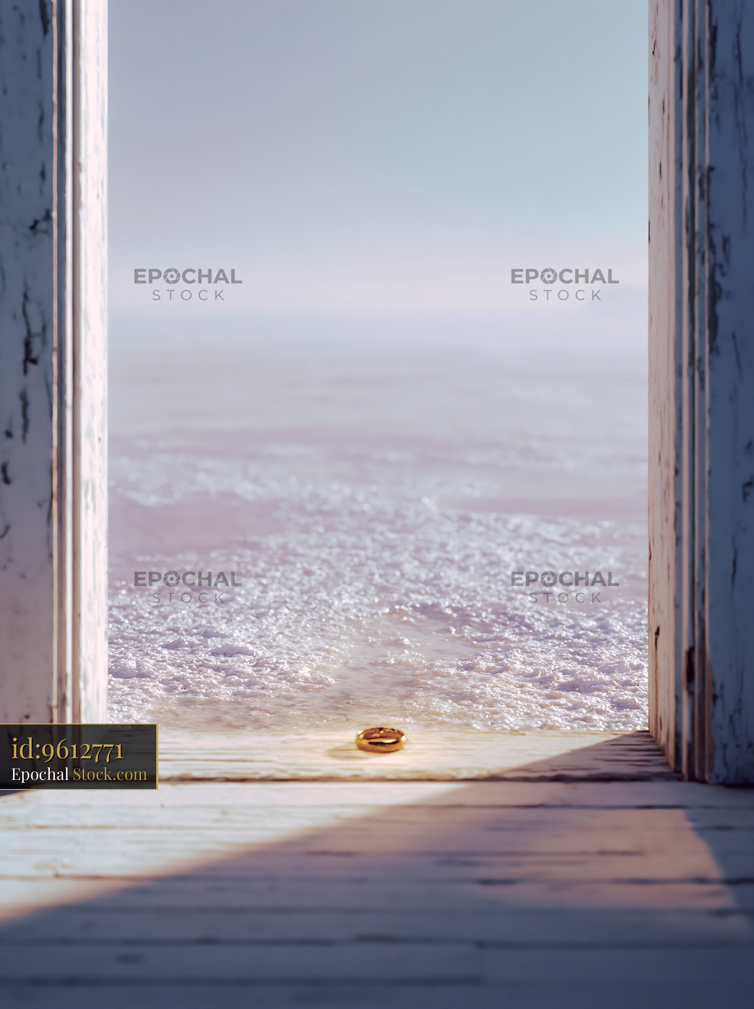 Gold wedding ring left on a weathered wooden threshold - stock photo