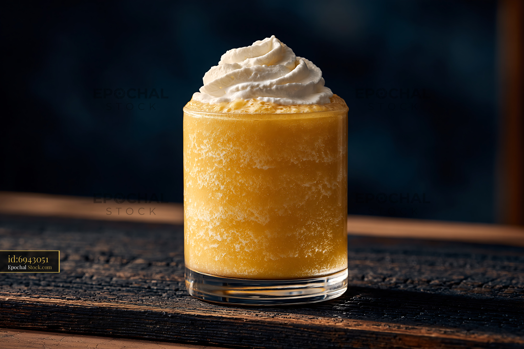 Pawpaw punch milkshake with whipped cream on rustic wooden table - stock photo