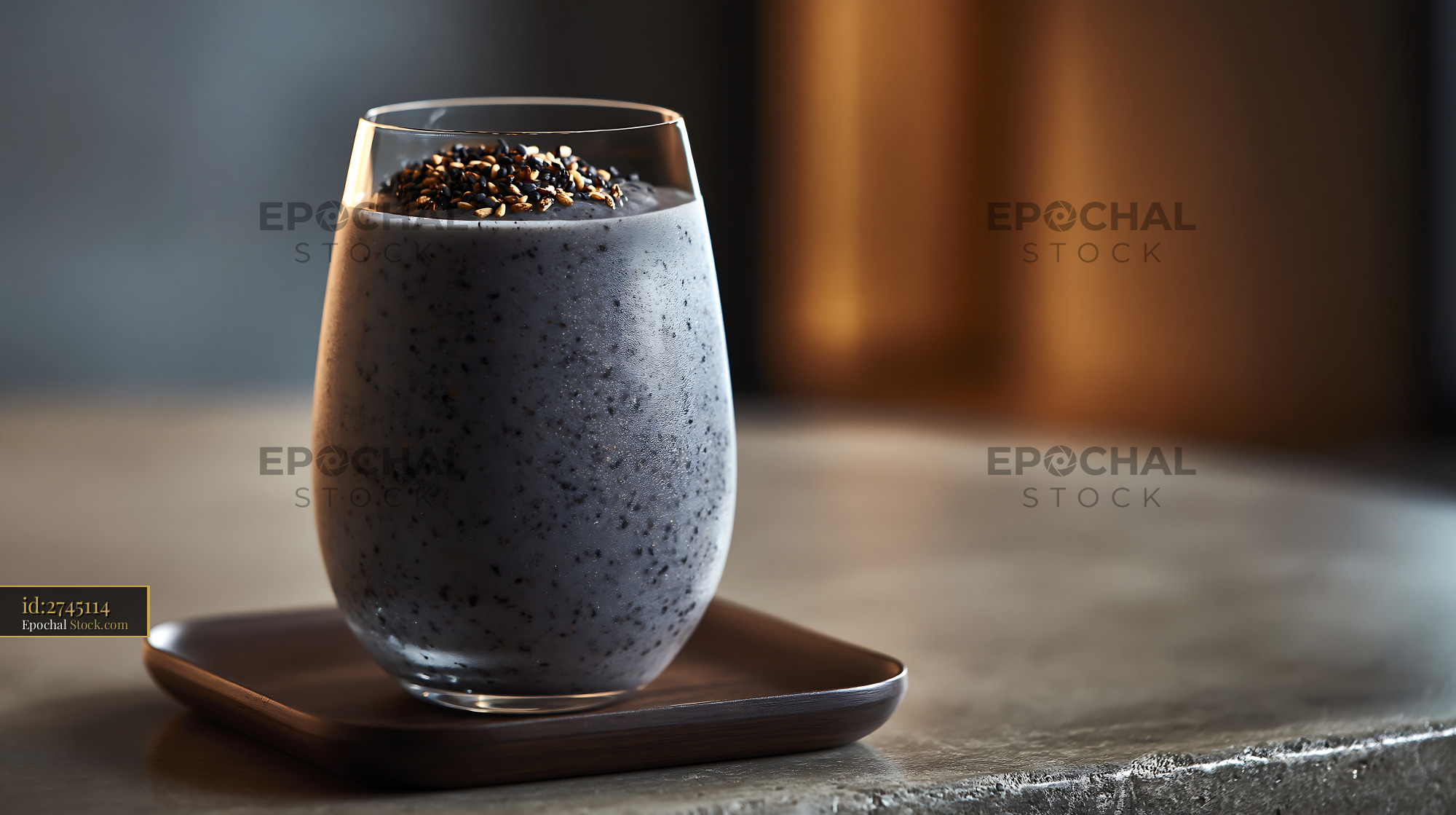 Kurogoma smoothie with black sesame seeds in a glass on wooden tray - stock photo