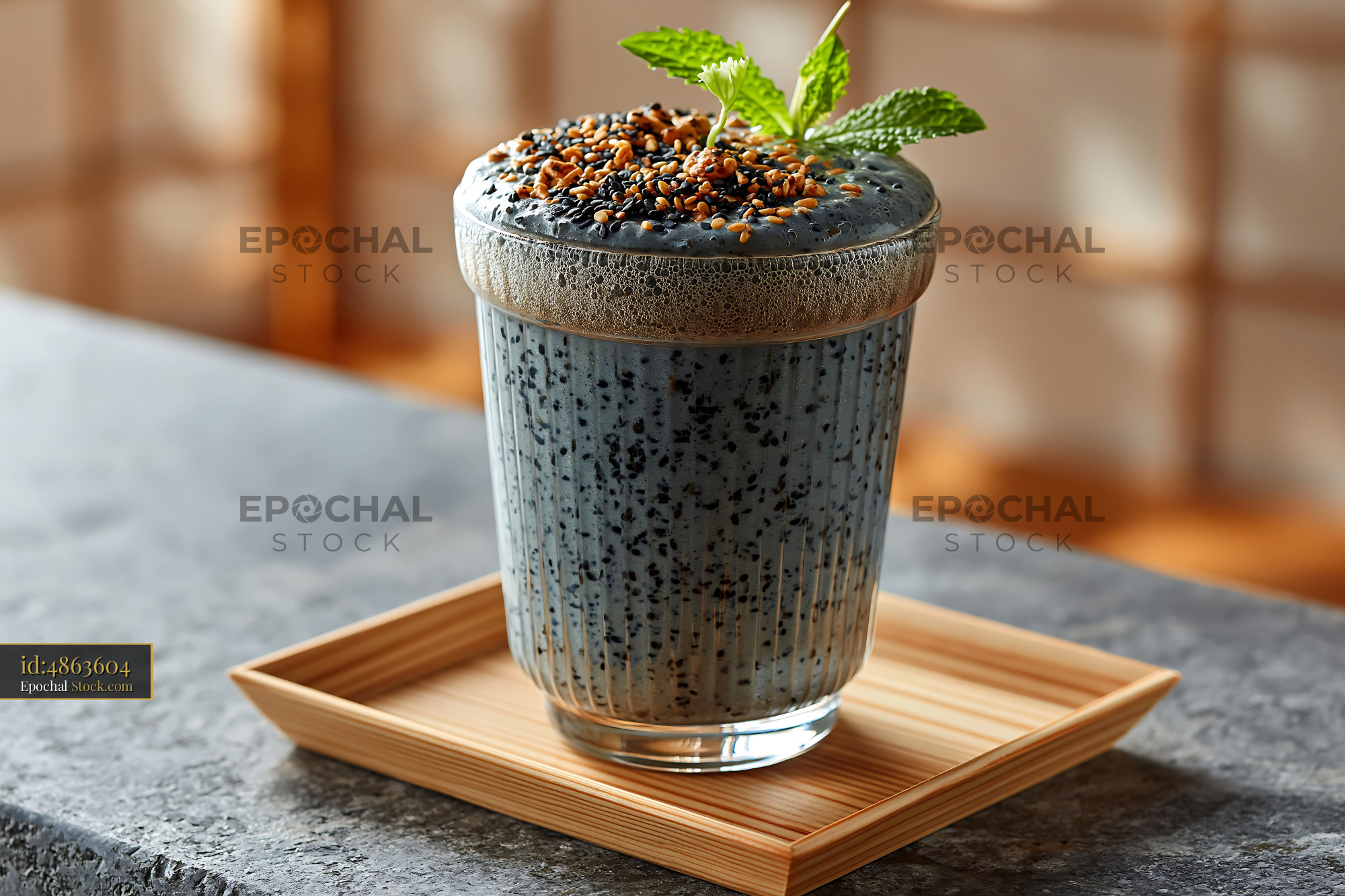 Kurogoma smoothie with toasted sesame seeds and fresh mint on a tray - stock photo