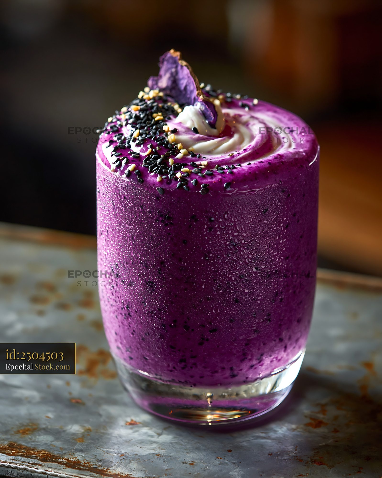 Beni imo smoothie with cream and black sesame seeds in a glass - stock photo
