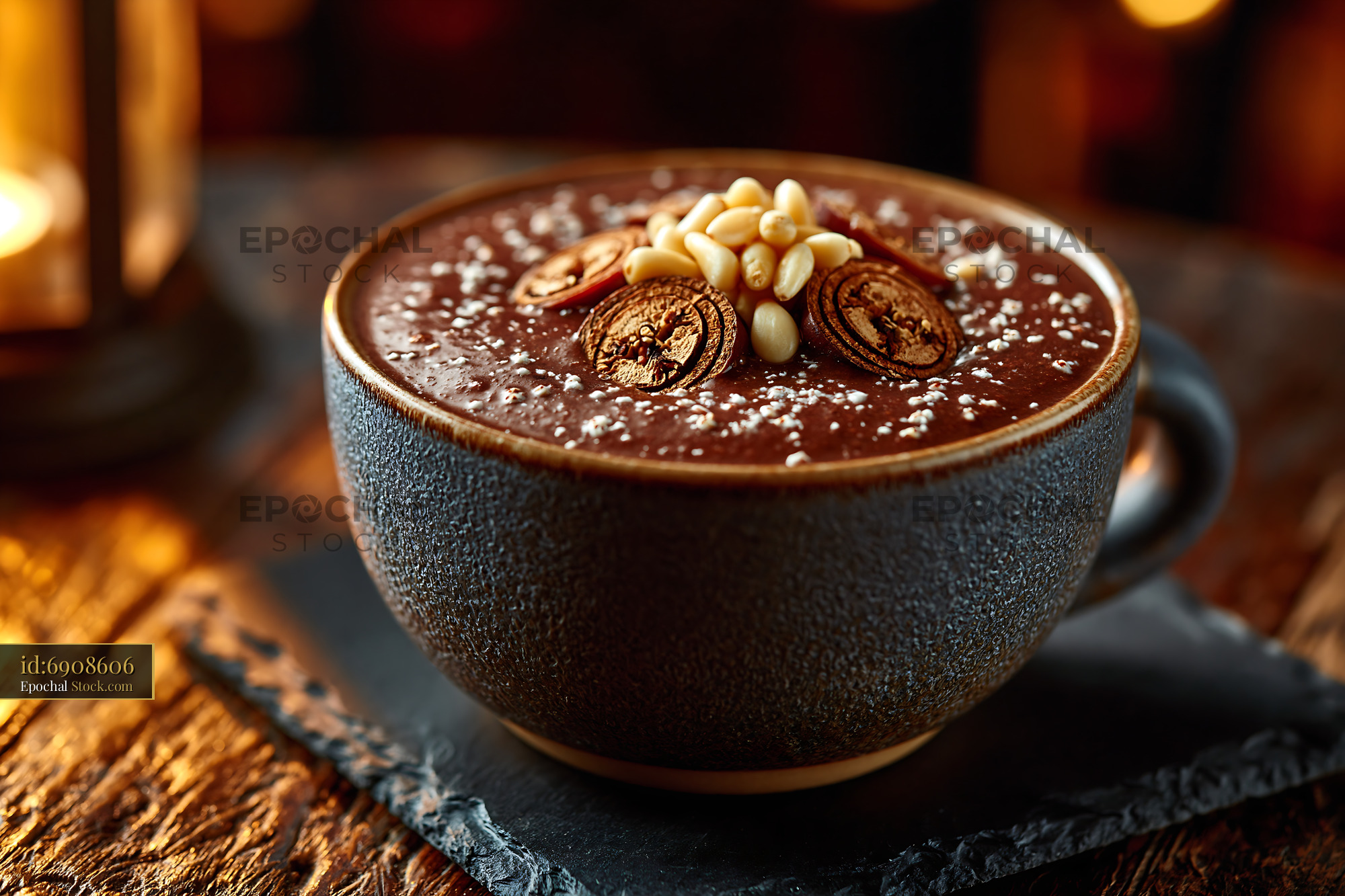 Creamy daechu jujube smoothie topped with pine nuts in a ceramic cup - stock photo