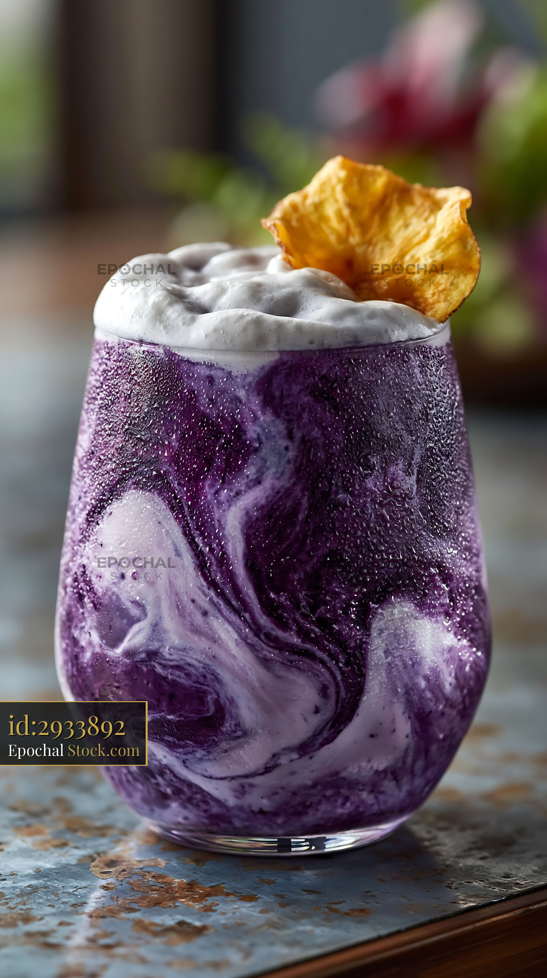 Beni imo smoothie with purple swirls and creamy foam topping - stock photo