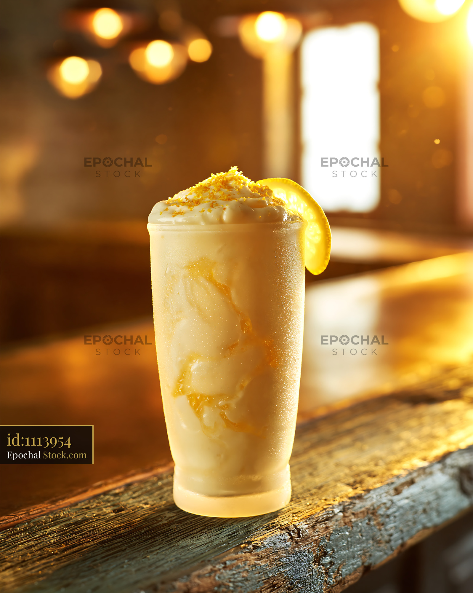 Creamy yuzu honey smoothie with citrus zest on a rustic wooden bar - stock photo