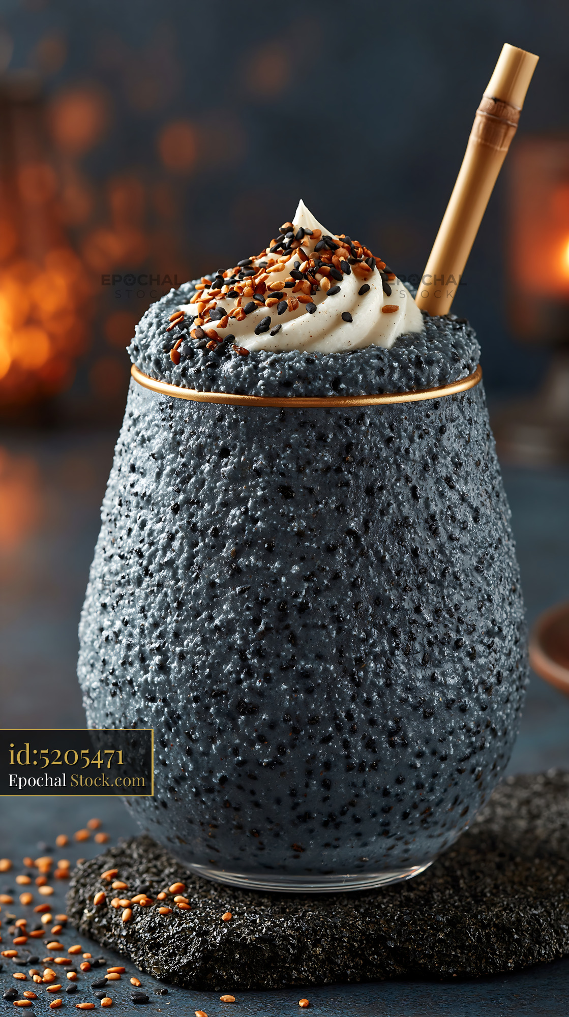 Kurogoma smoothie with whipped cream and sesame seeds in textured glas - stock photo