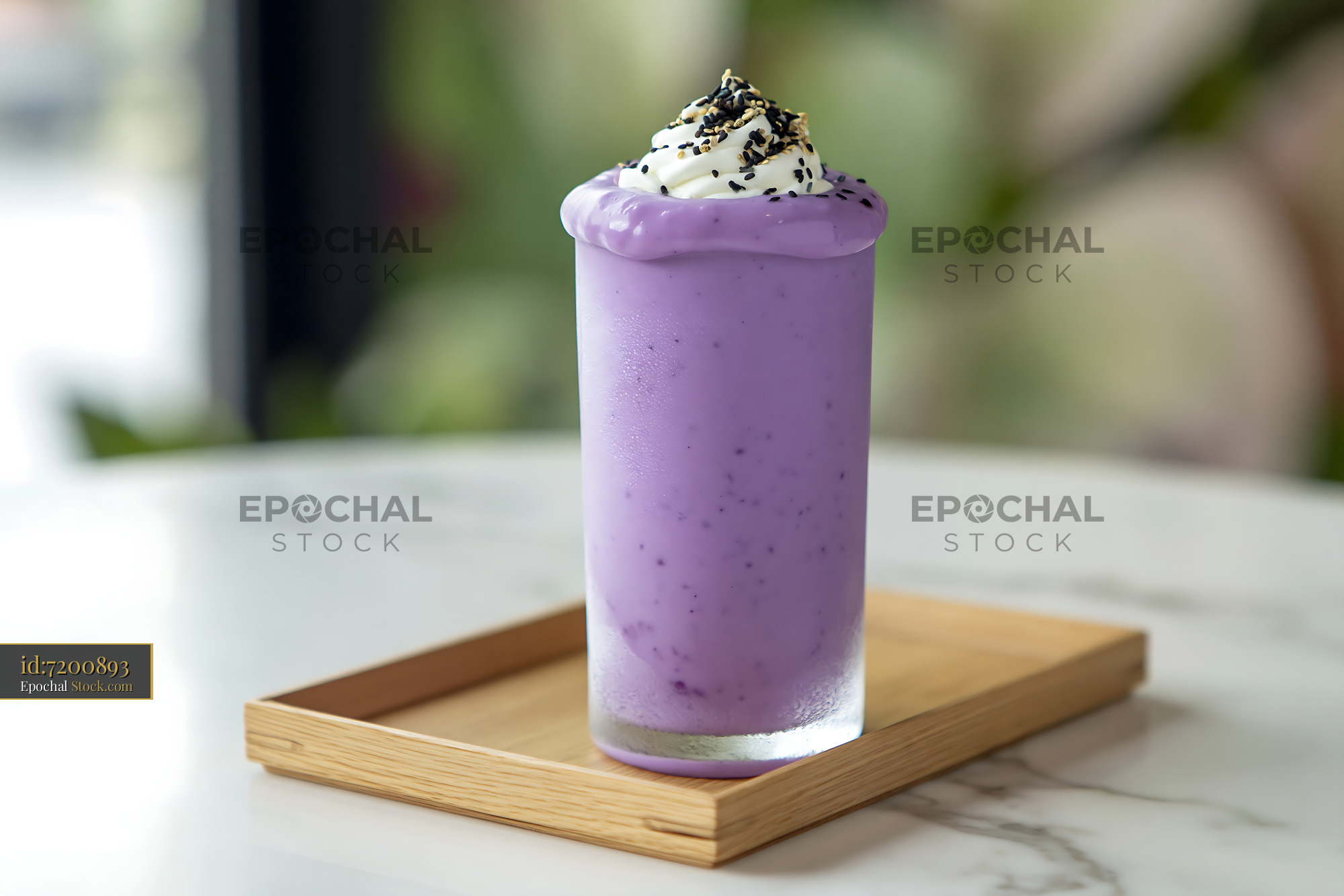 Purple beni imo smoothie topped with whipped cream and sesame - stock photo