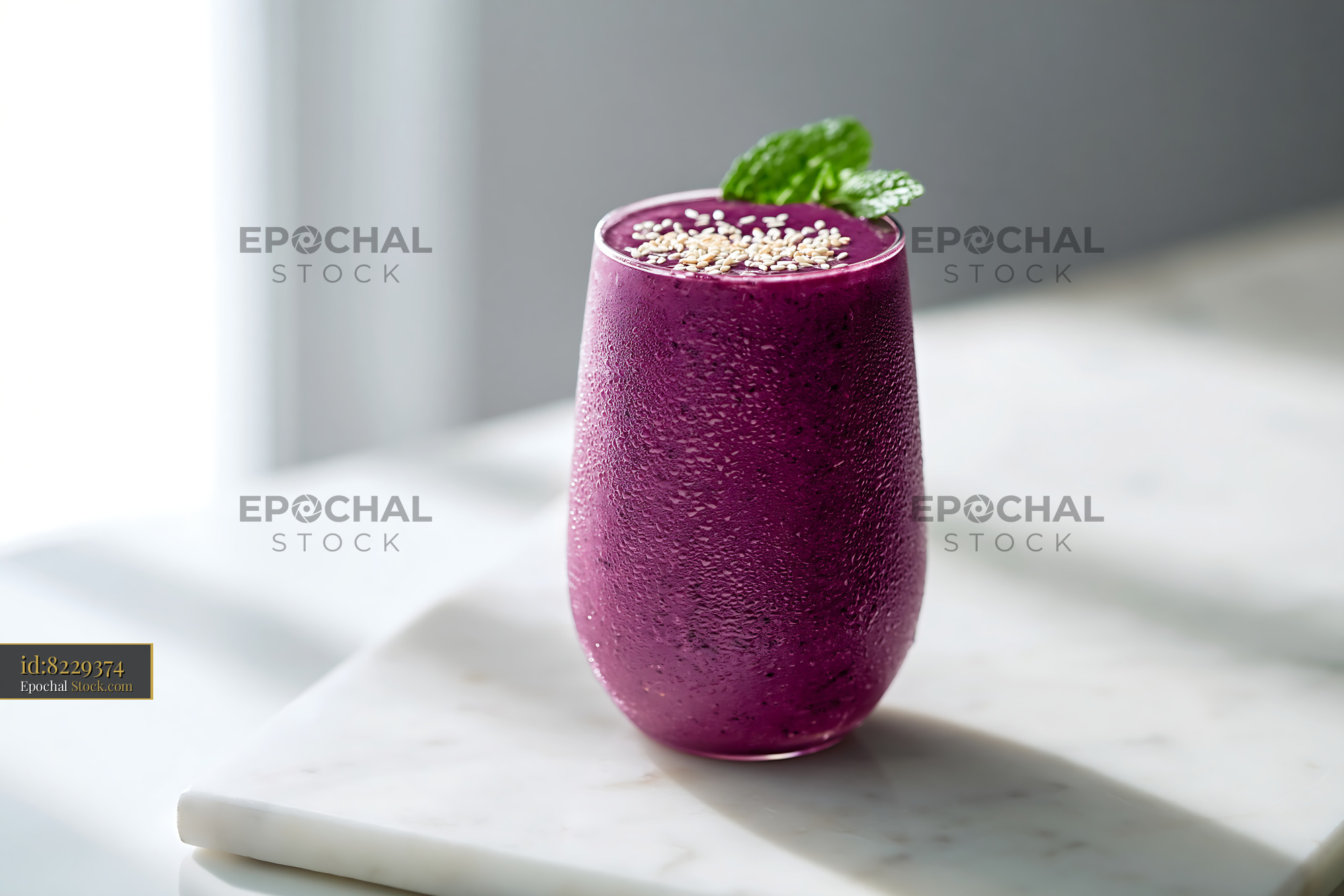 Purple sweet potato smoothie with sesame seeds and mint - stock photo