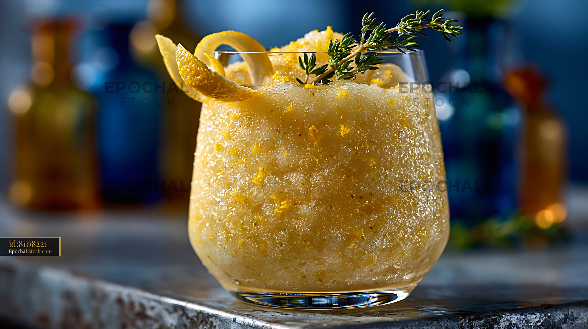 Refreshing frozen yuja citron smoothie with lemon twist and thyme - stock photo
