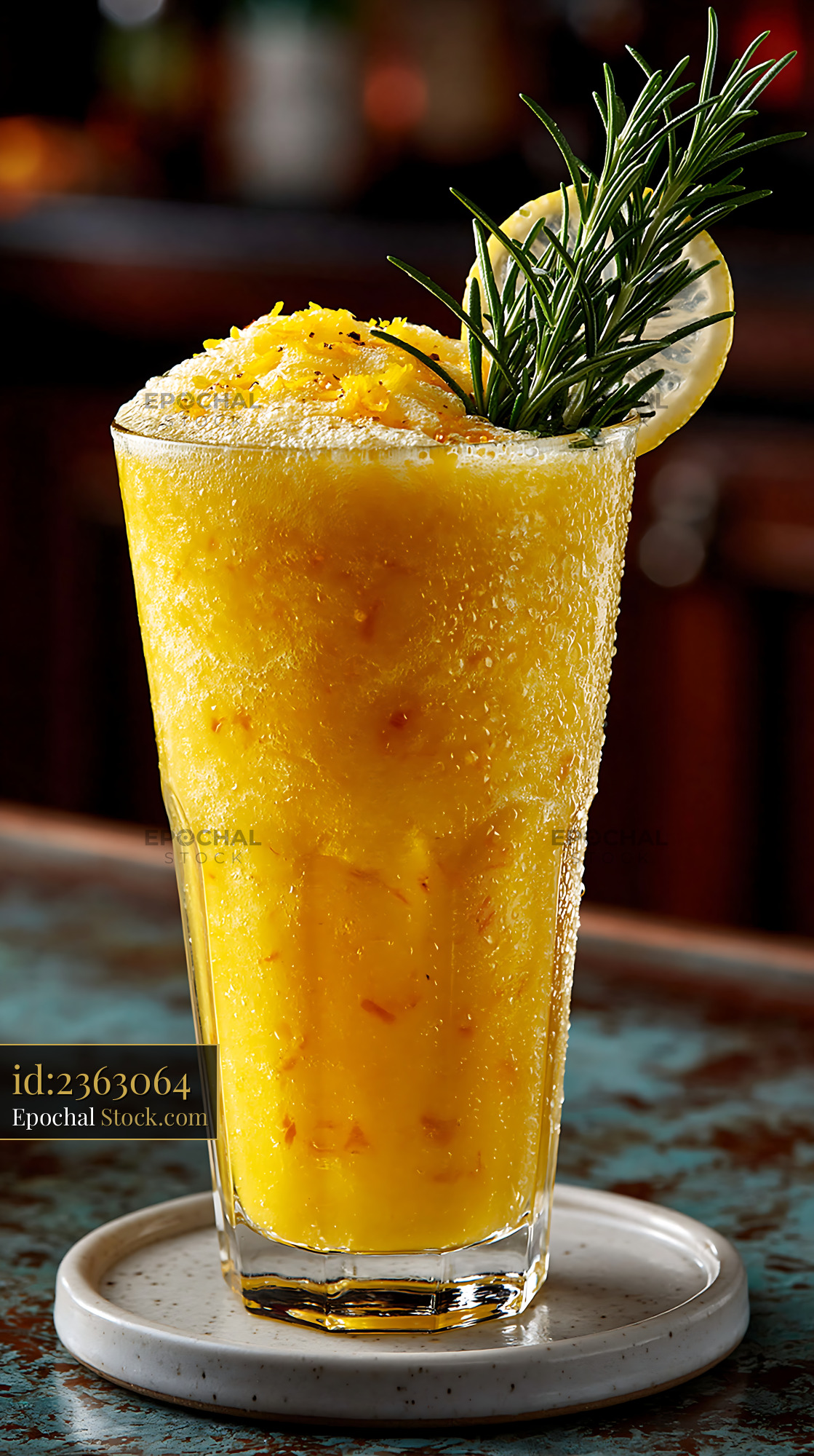 Refreshing yuja citron smoothie garnished with rosemary and lemon - stock photo