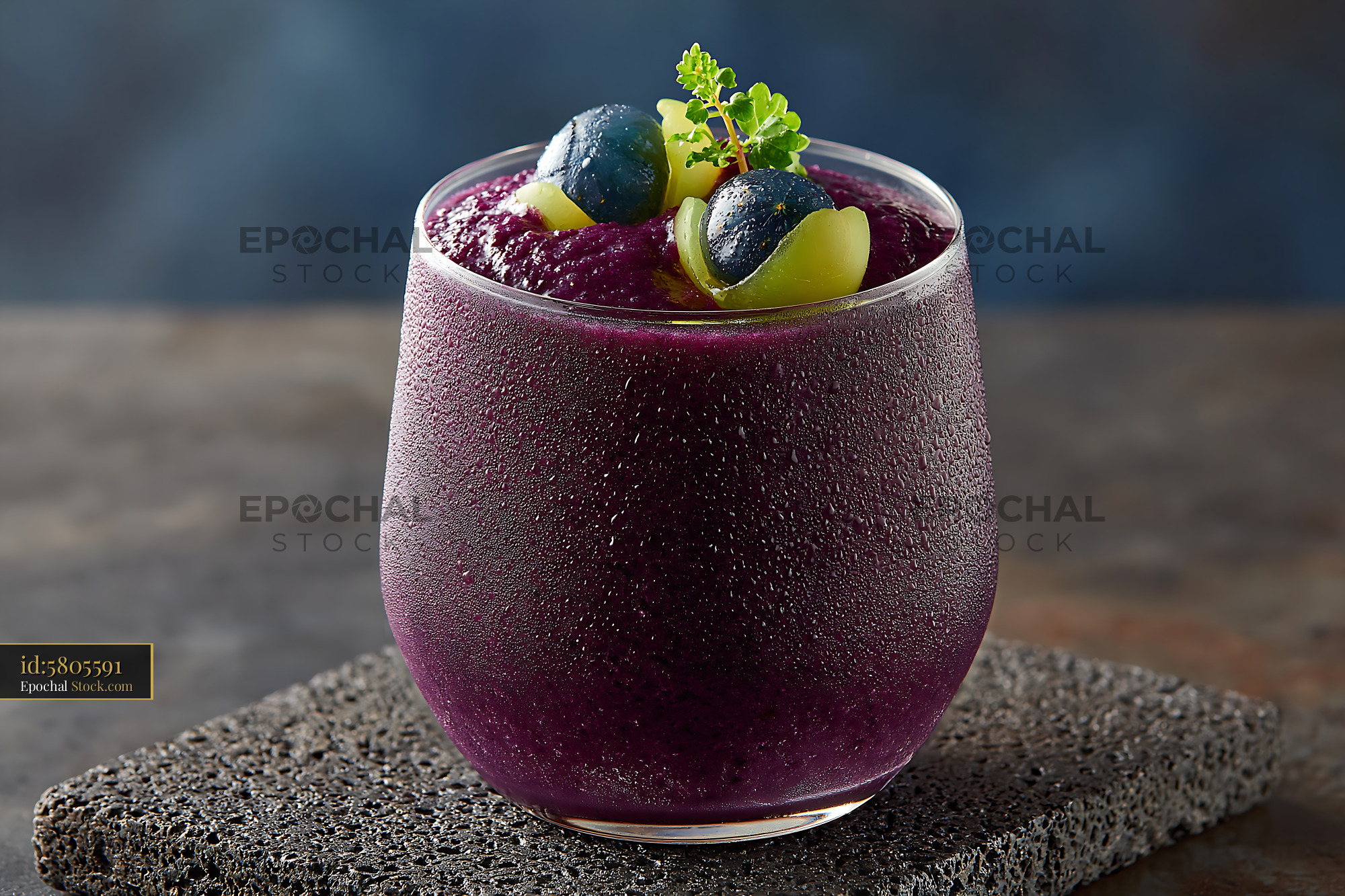 Chilled kyoho grape smoothie in a frosted glass with fresh fruit - stock photo