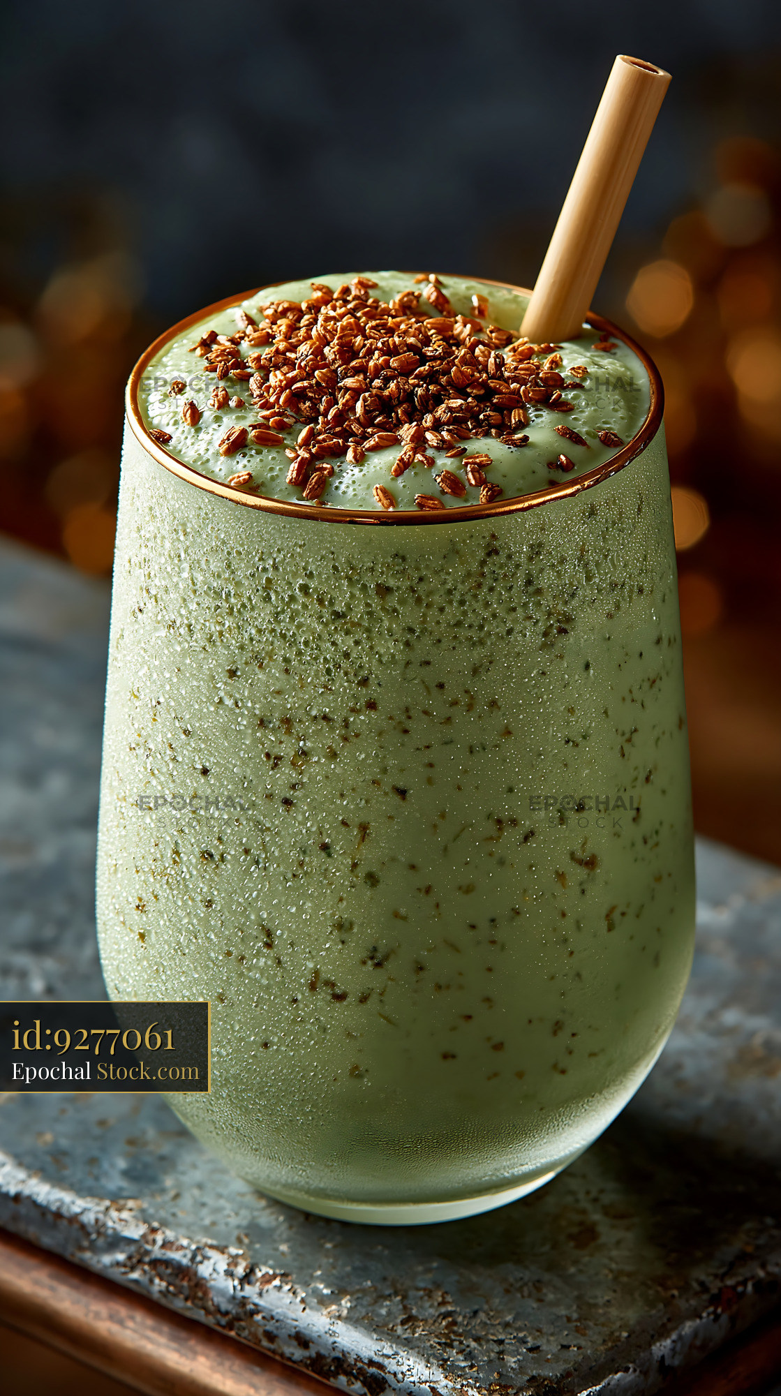 Creamy genmaicha tea smoothie with roasted rice and bamboo straw - stock photo