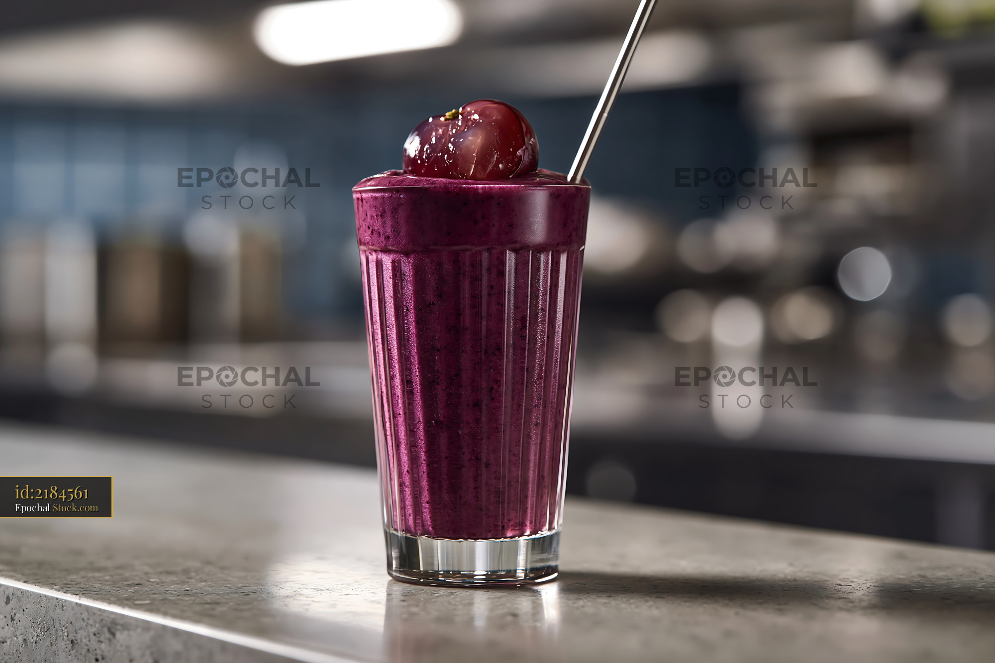 Purple kyoho grape smoothie with fresh grape topping on a bar counter - stock photo