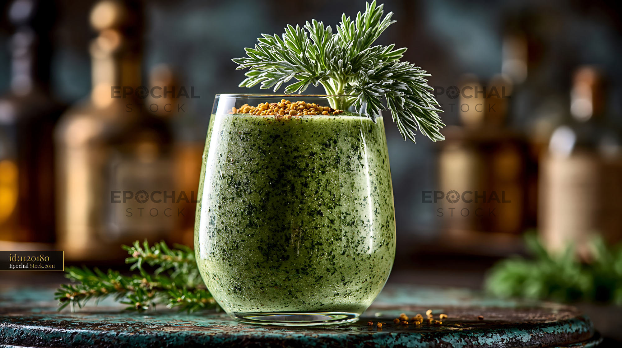 Mugwort herb smoothie with fresh garnish in a rustic setting - stock photo