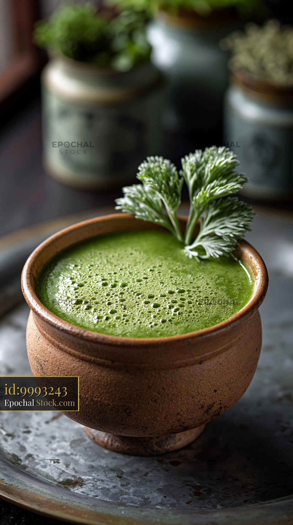 Healthy mugwort herb smoothie in a rustic clay bowl - stock photo