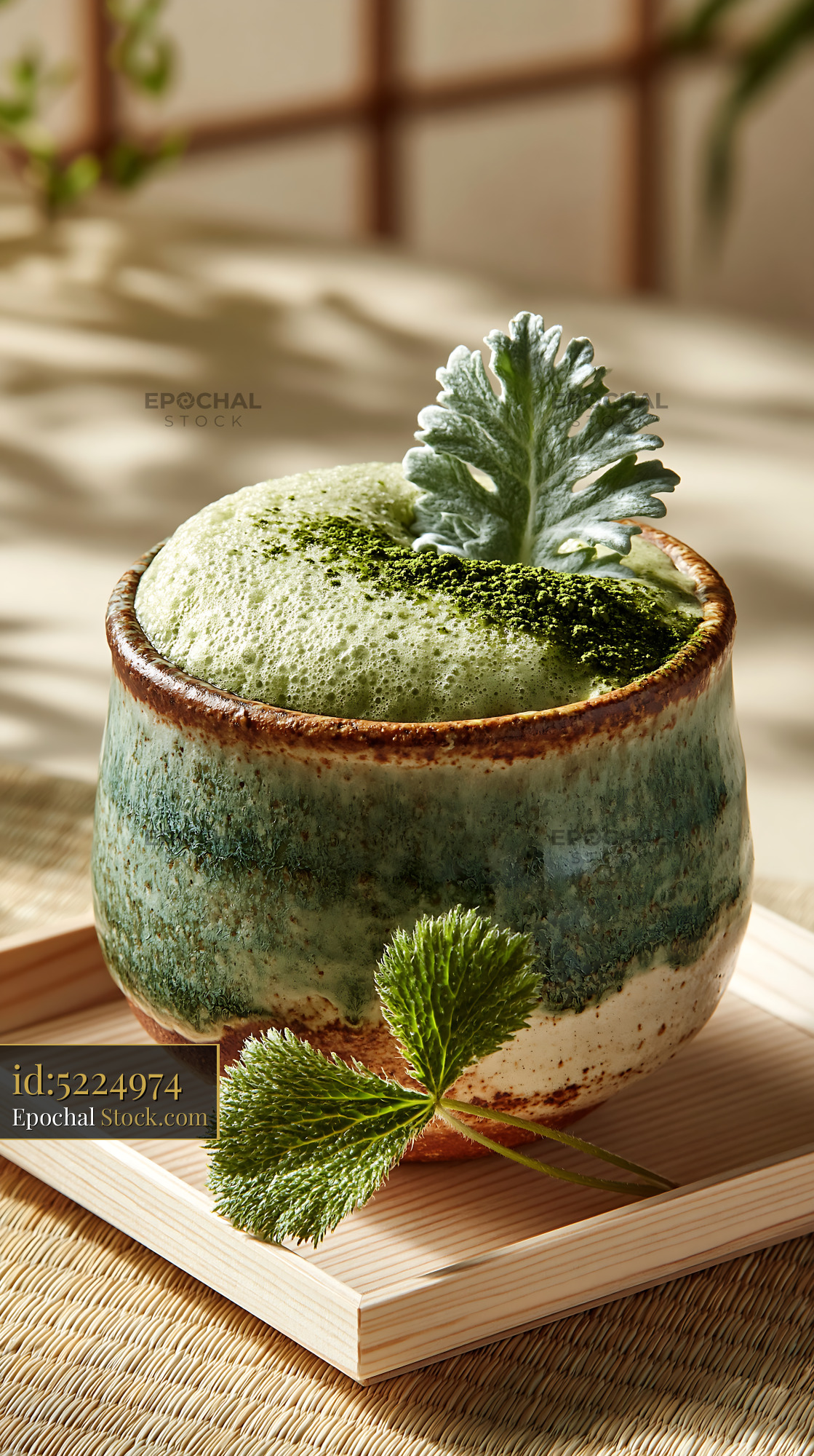Mugwort herb smoothie in a rustic ceramic cup on a wooden tray - stock photo