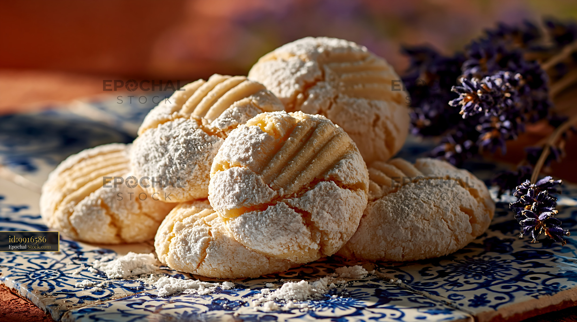 Traditional un kurabiyesi biscuits dusted with sugar on blue tiles - stock photo