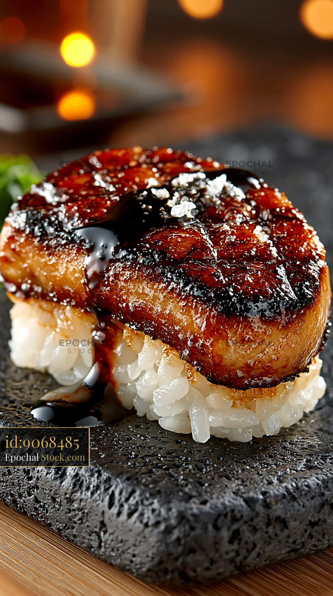 Pan-seared foie gras nigiri sushi with balsamic glaze on stone plate - stock photo