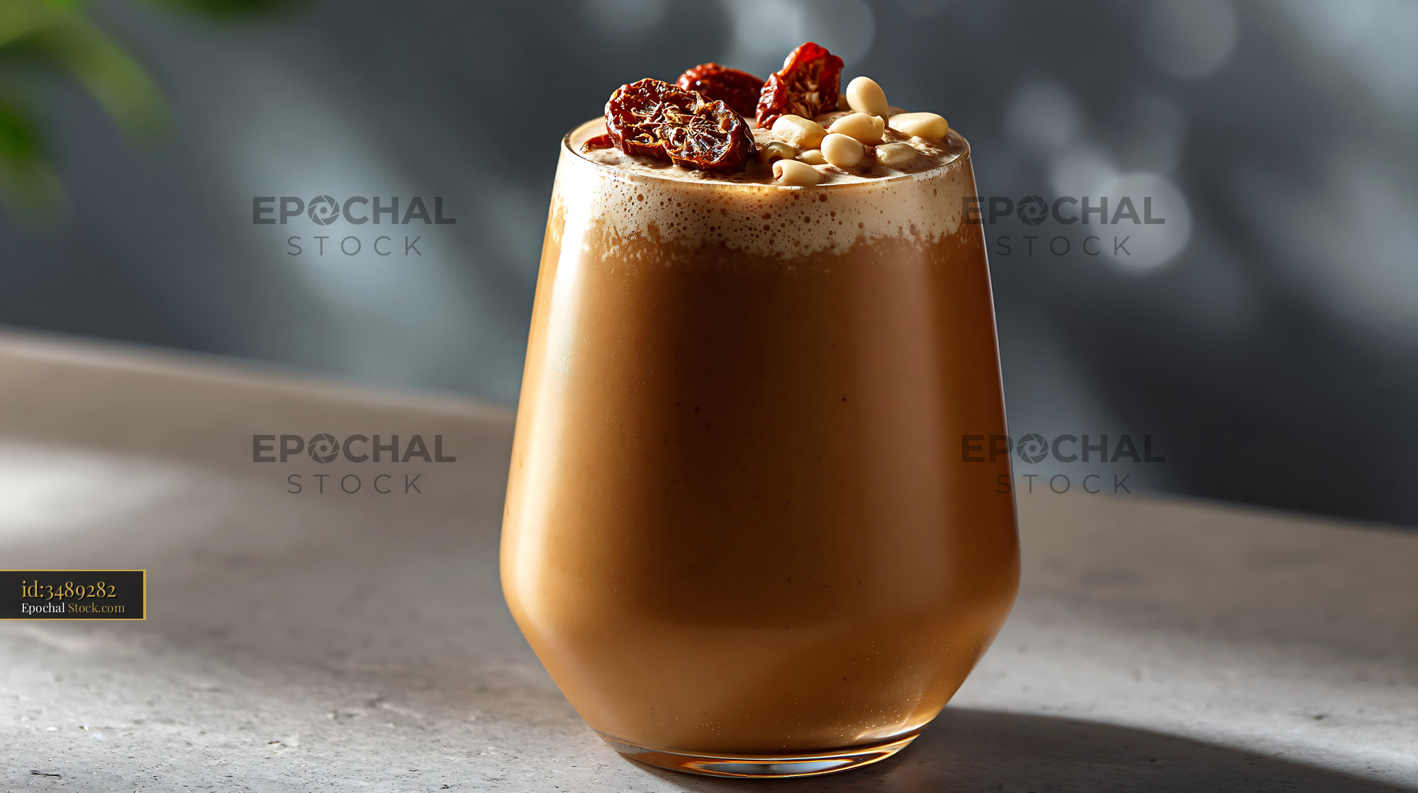 Daechu jujube smoothie topped with dried red dates and pine nuts - stock photo