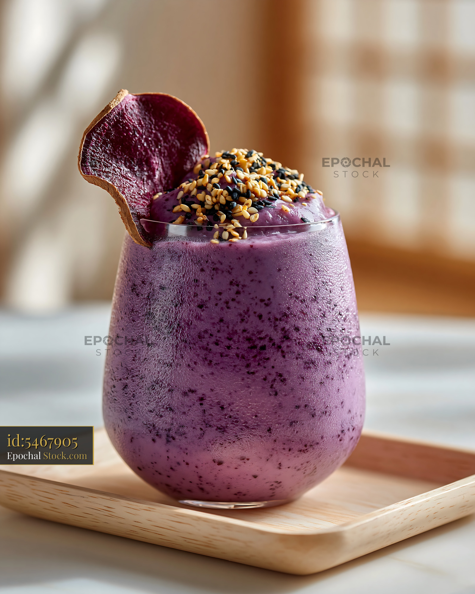 Refreshing purple beni imo smoothie with sesame seeds and garnish - stock photo