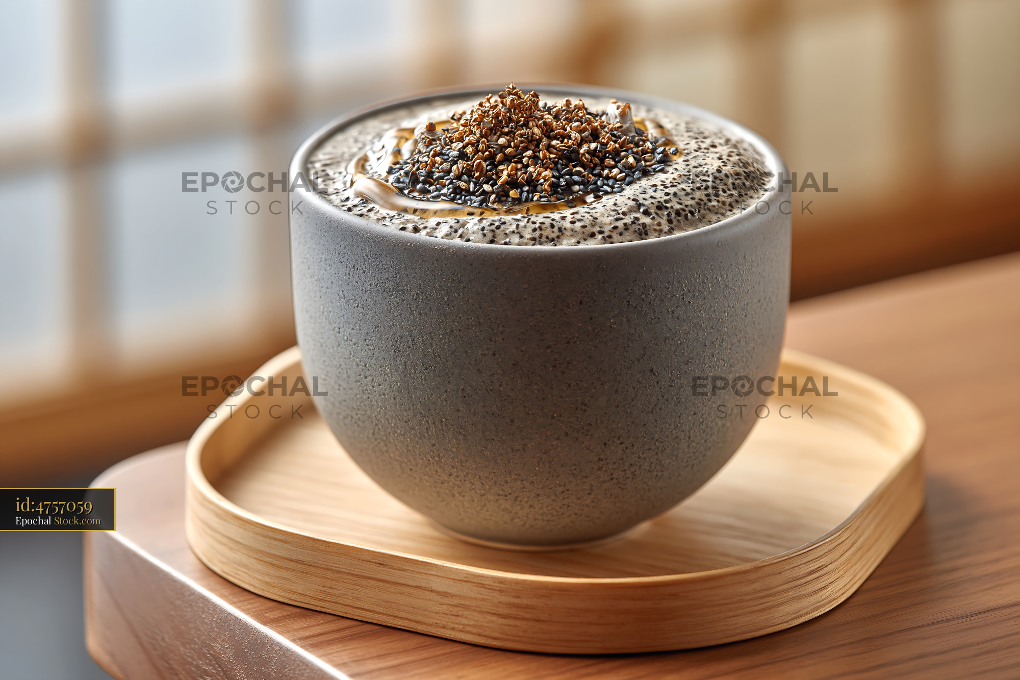 Kurogoma smoothie with black sesame seeds and honey in a ceramic bowl - stock photo