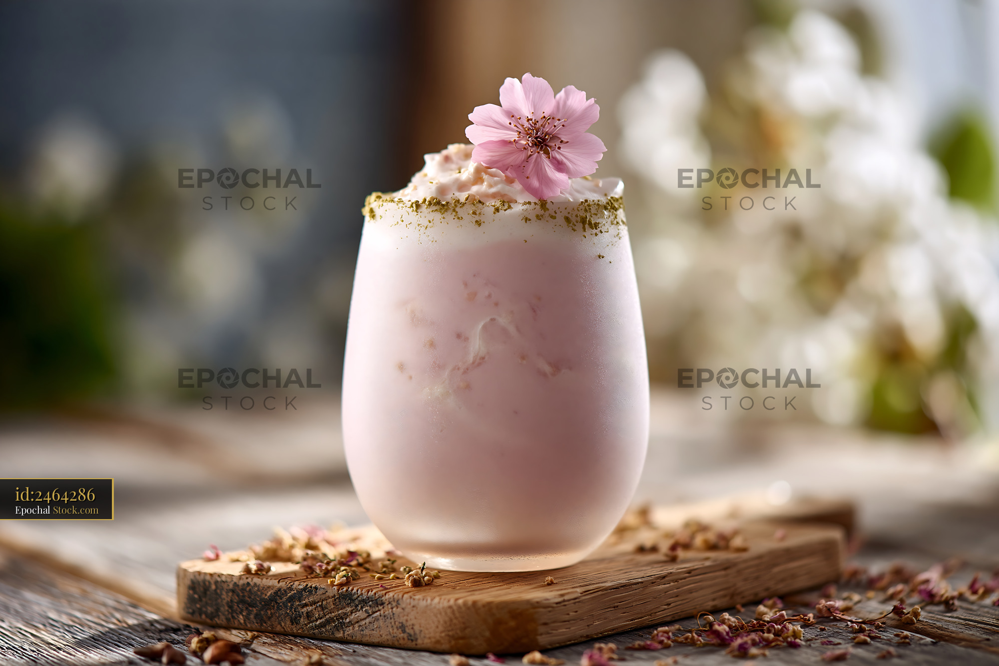 Creamy sakura blossom smoothie garnished with a fresh cherry flower - stock photo