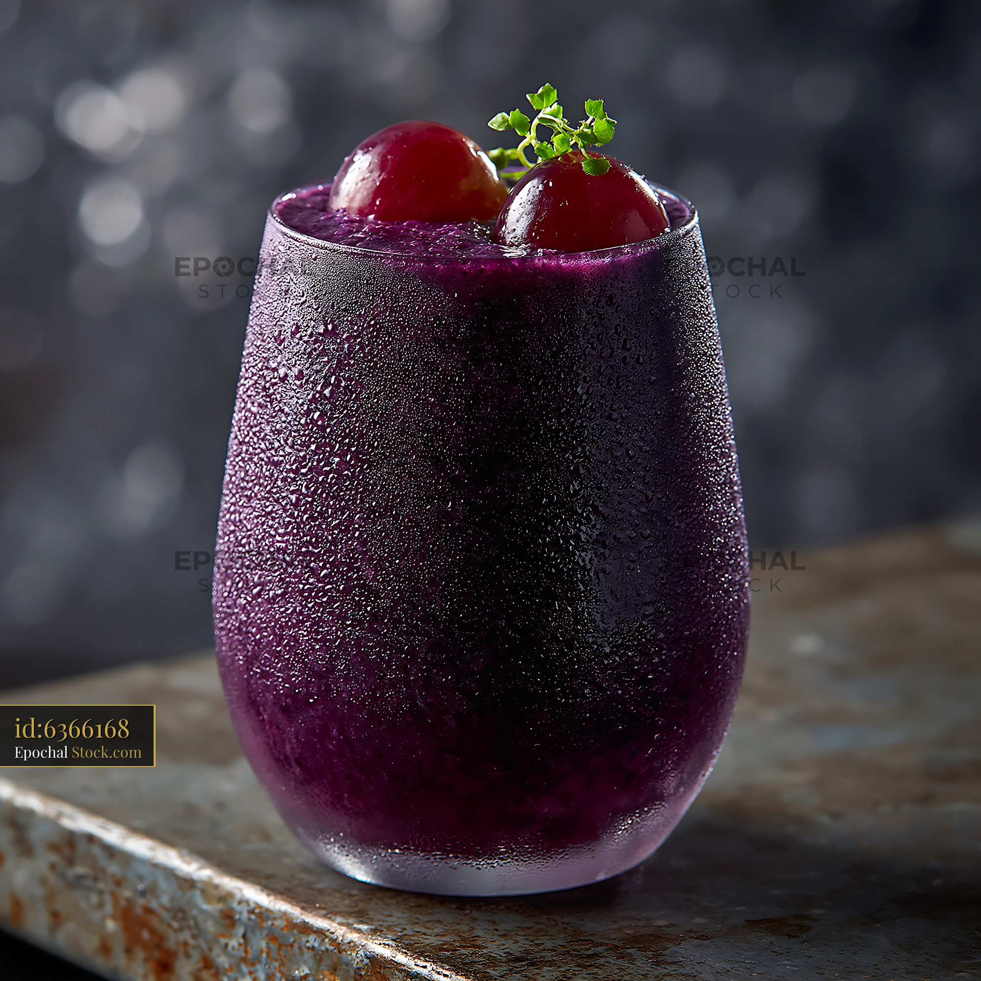 Kyoho grape smoothie in a frosted glass with fresh fruit garnish - stock photo