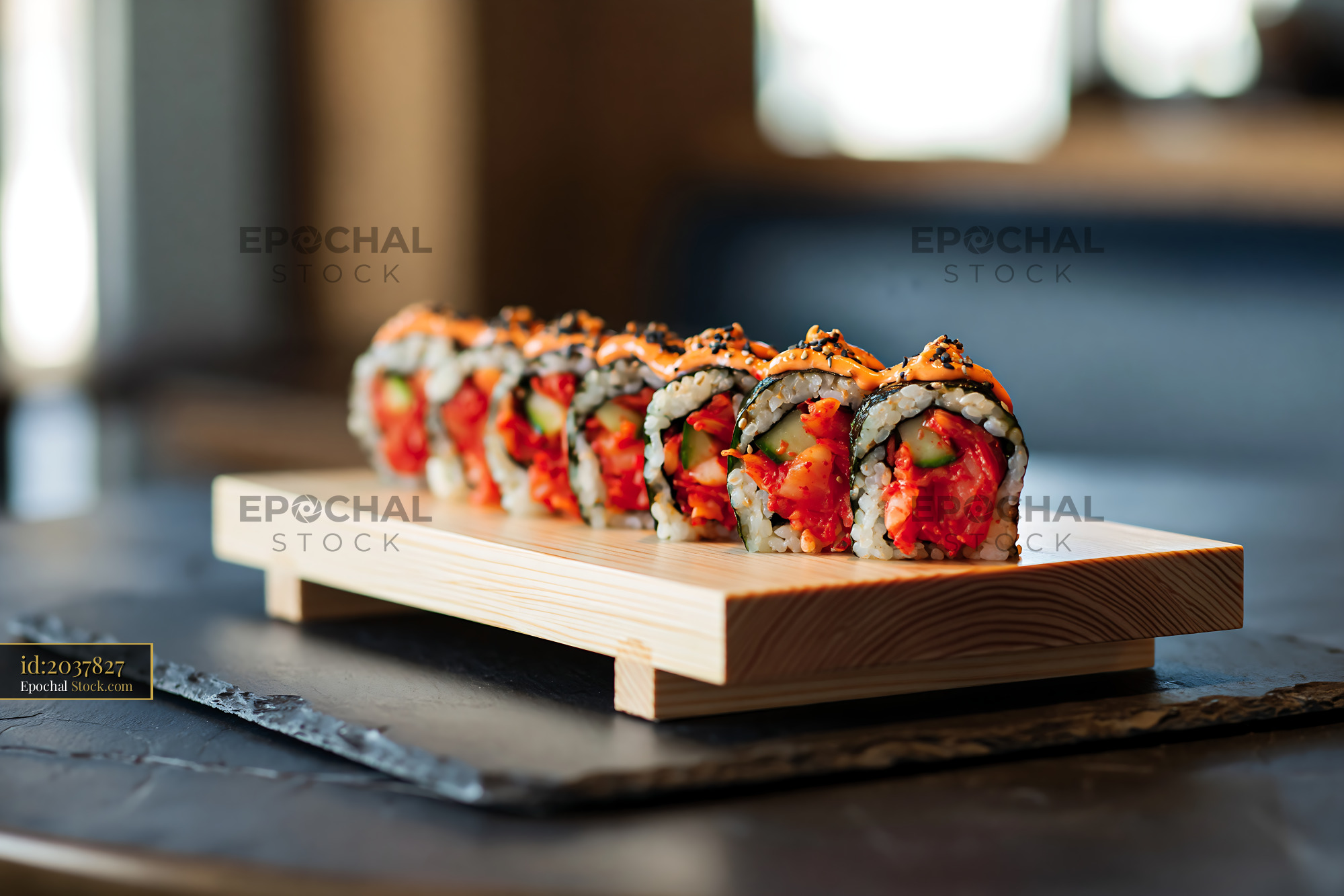 Fresh kimchi fusion maki sushi rolls served on a wooden board - stock photo