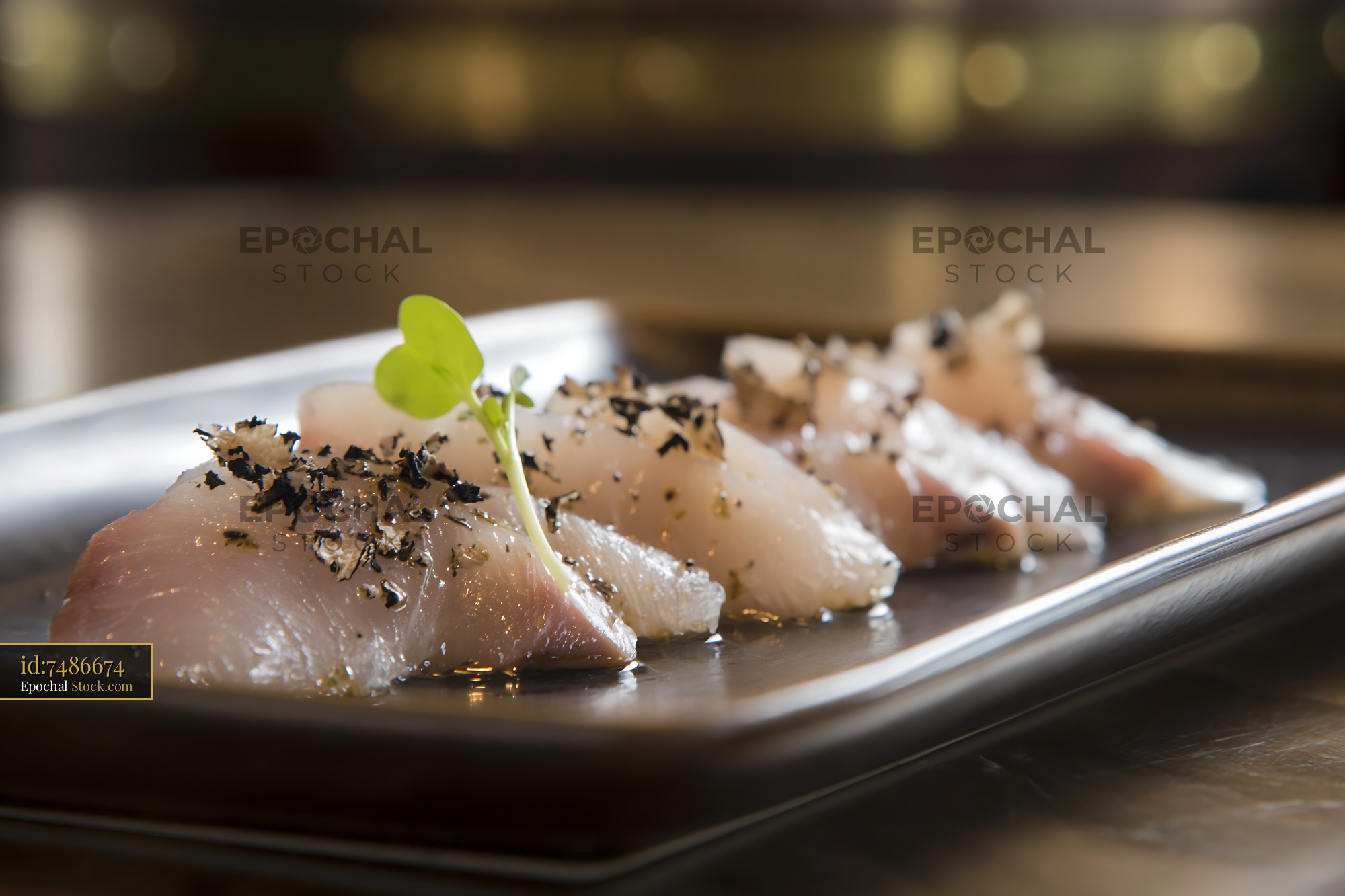 Truffle yellowtail sushi with black truffle shavings and microgreen - stock photo