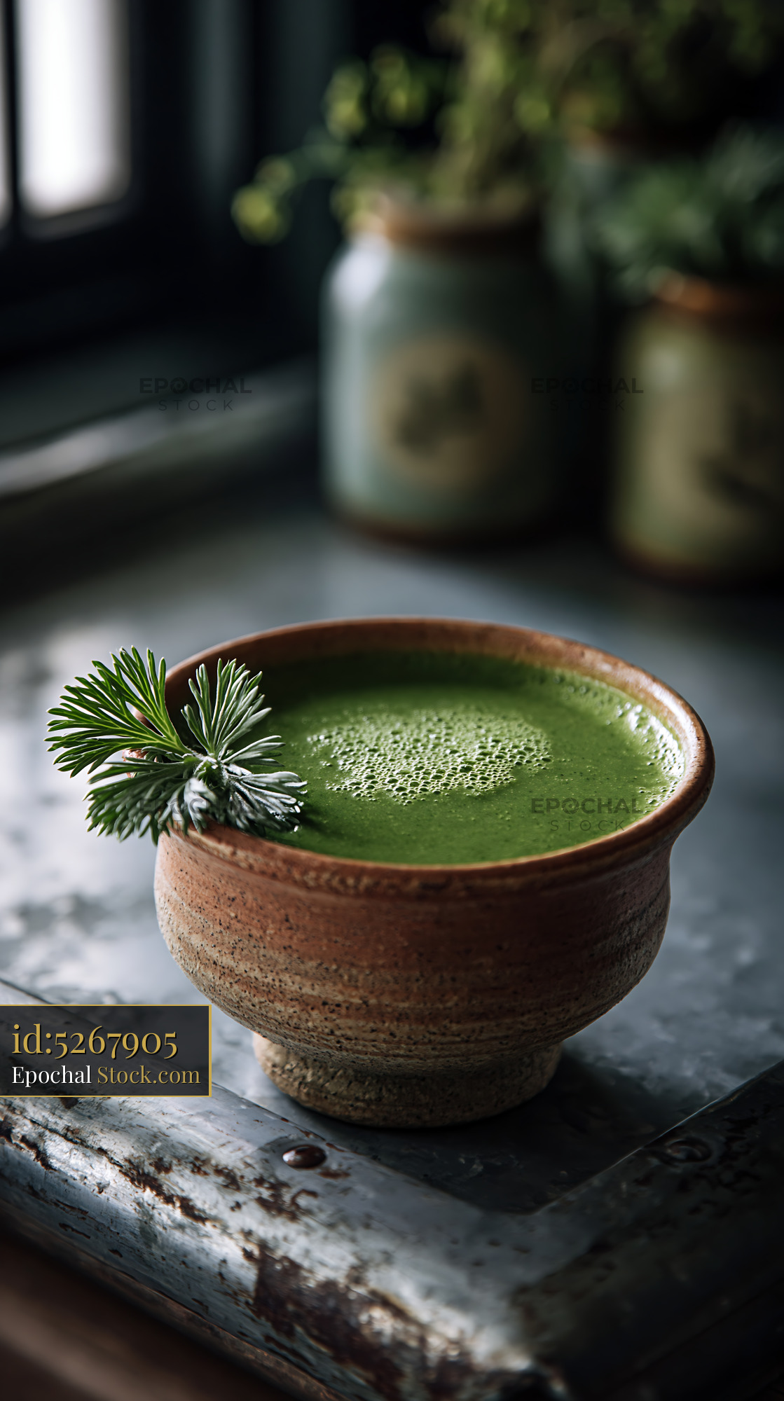 Mugwort herb smoothie in a rustic ceramic bowl for natural wellness - stock photo