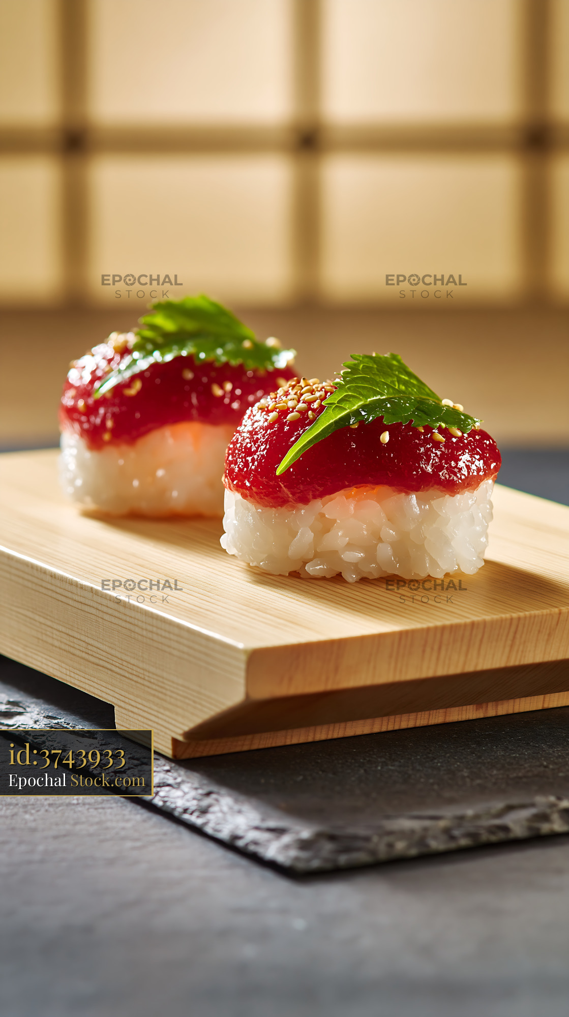 Salted plum umeboshi sushi with shiso leaf on wooden board - stock photo